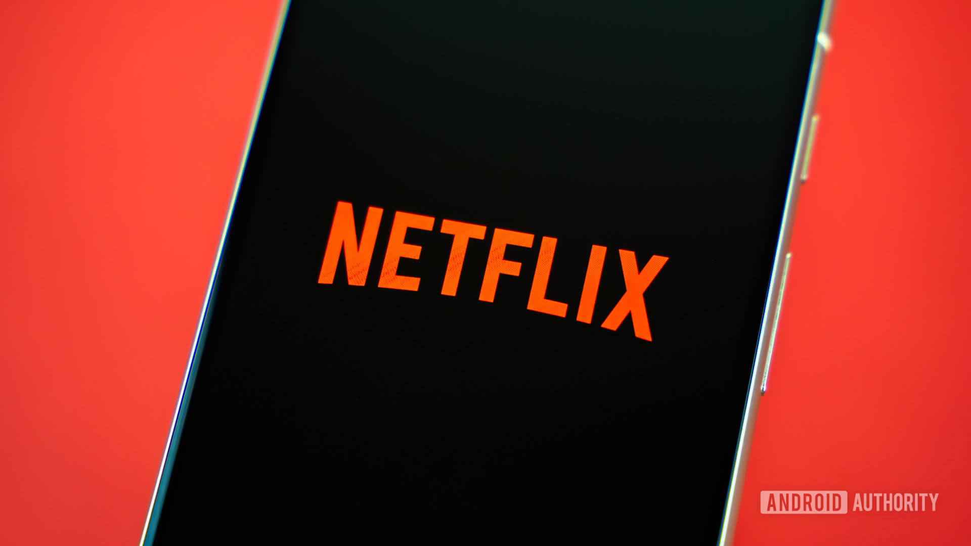 Netflix logo on smartphone stock photo (1)