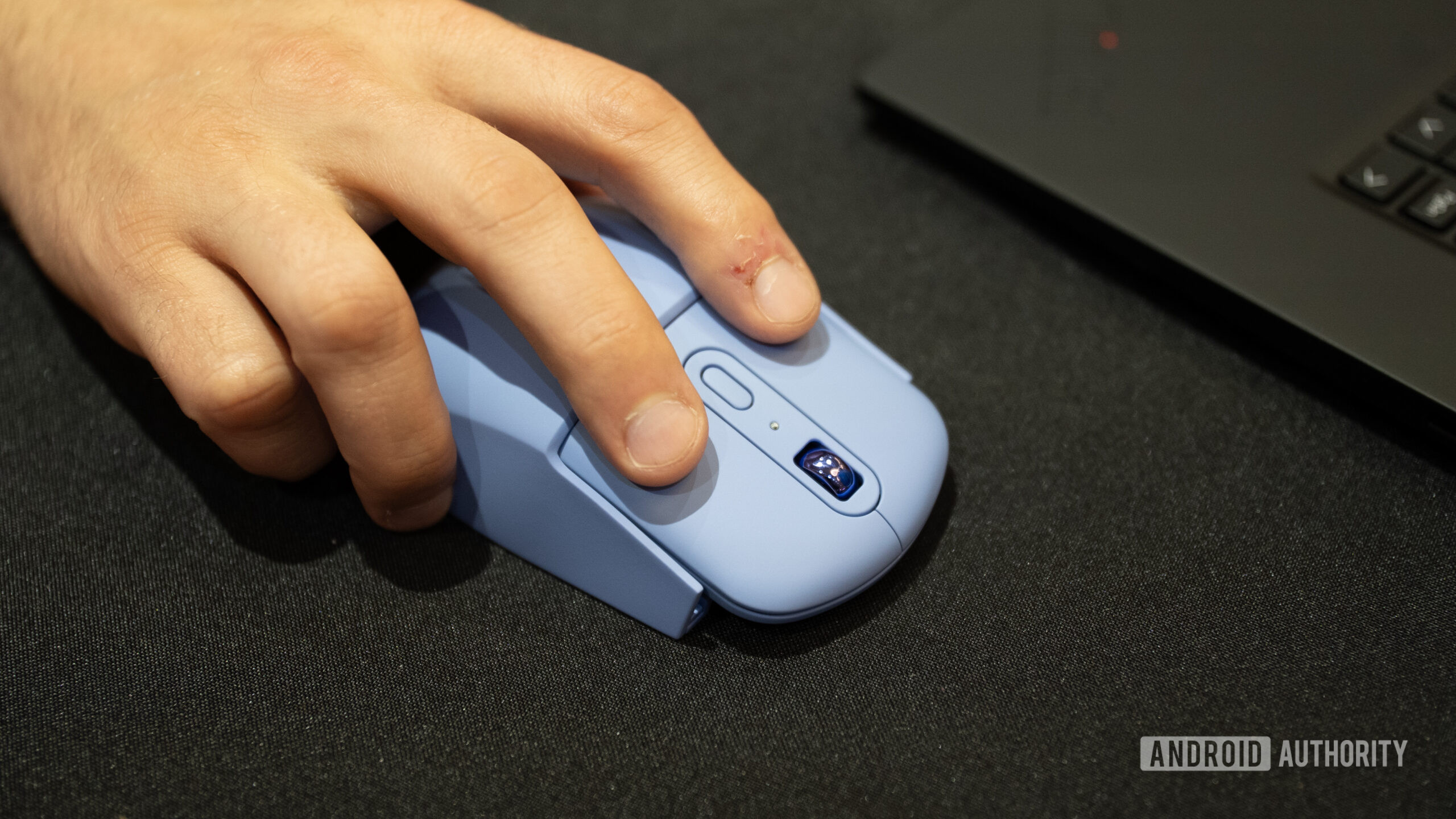 Lenovo AdaptX Mouse in ergonomic grip in use