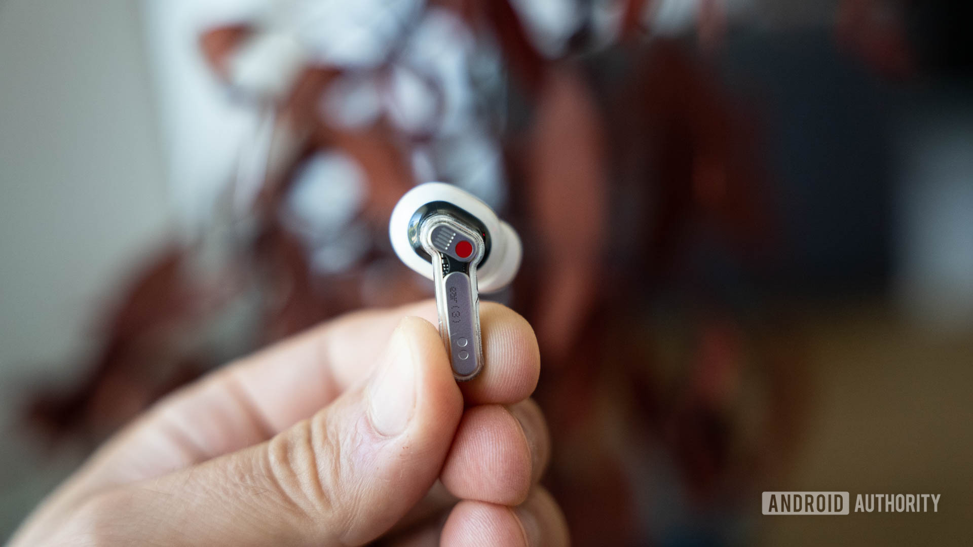 Nothing Ear 3 single earbud in a man's hands Nothing Ear 3 single earbud in a man's hands