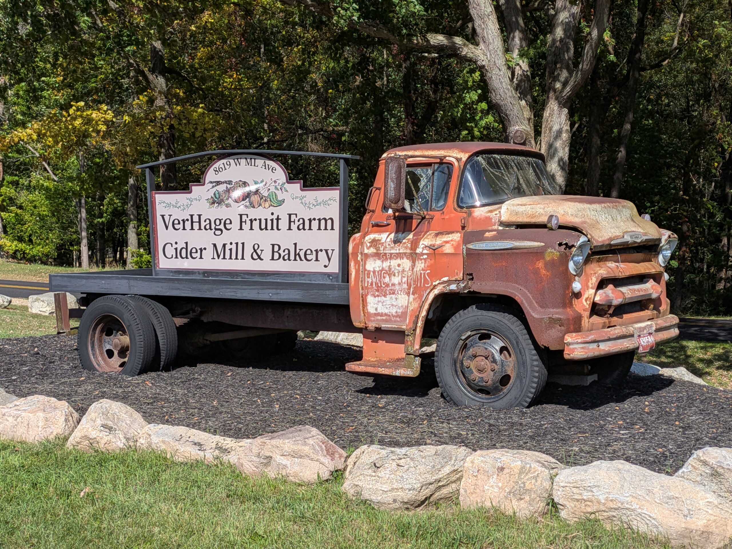 A picture of an old truck with a sign on the back, taken with the Google Pixel 10 Pro Fold.
