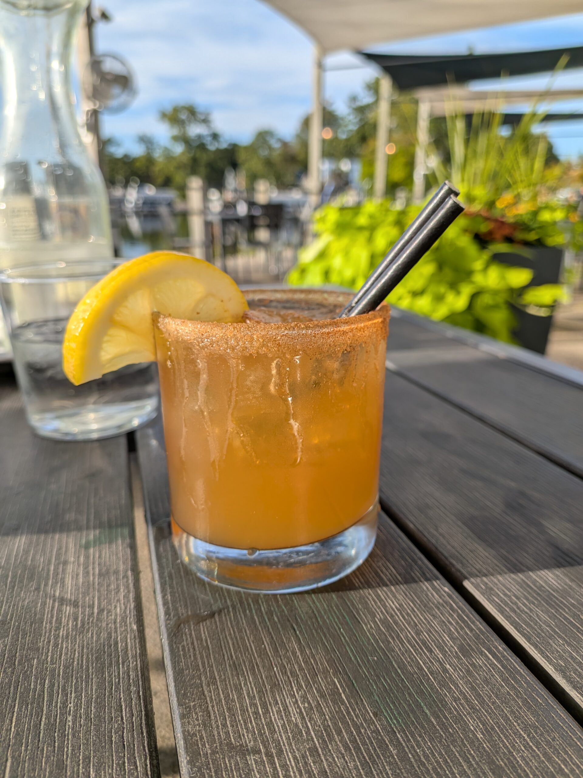 A picture of a cocktail with a lemon on the side, taken with the Pixel 10 Pro Fold.