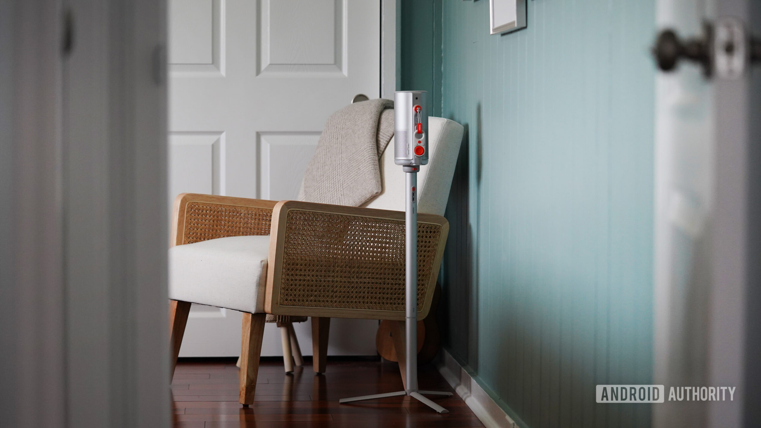 XGIMI Mogo 4 Stand An XGIMI Mogo 4 is tucked into the corner of a bedroom.