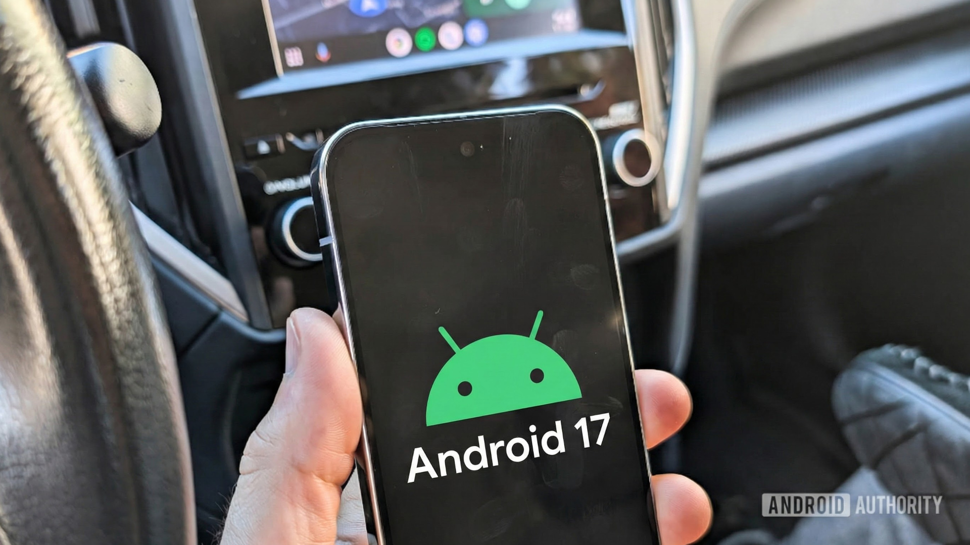 Android 17 logo on a Pixel phone held in a car 2 Android 17 logo on a Pixel phone held in a car 2