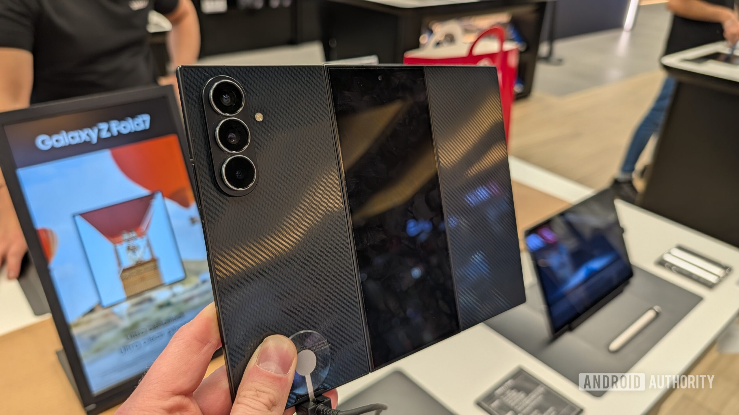 Samsung Galaxy Z TriFold Someone holding the Galaxy Z TriFold, showing the back of the phone.