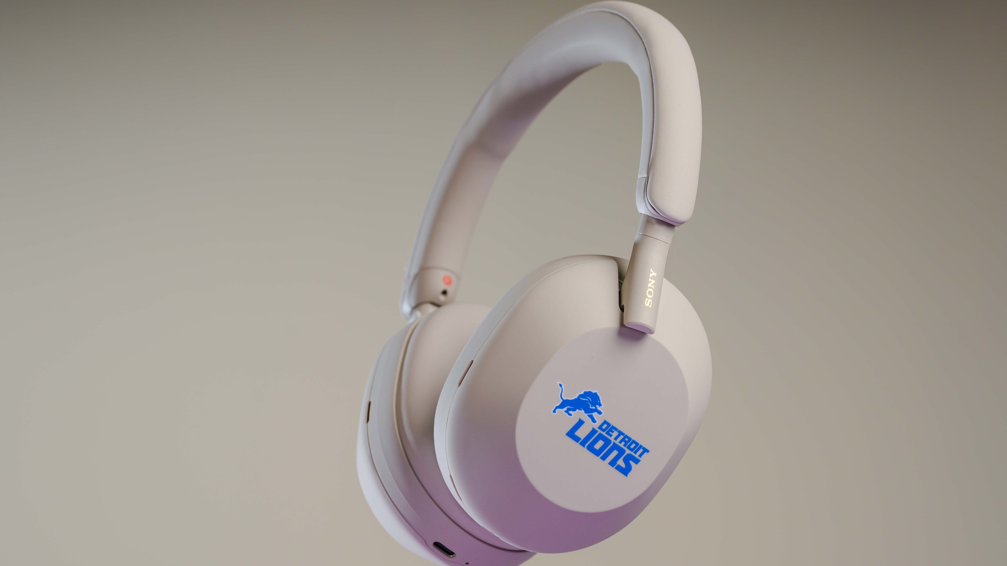 Sony WH 1000XM5 headphones with Detroit Lions' blue logo displayed on the earcups