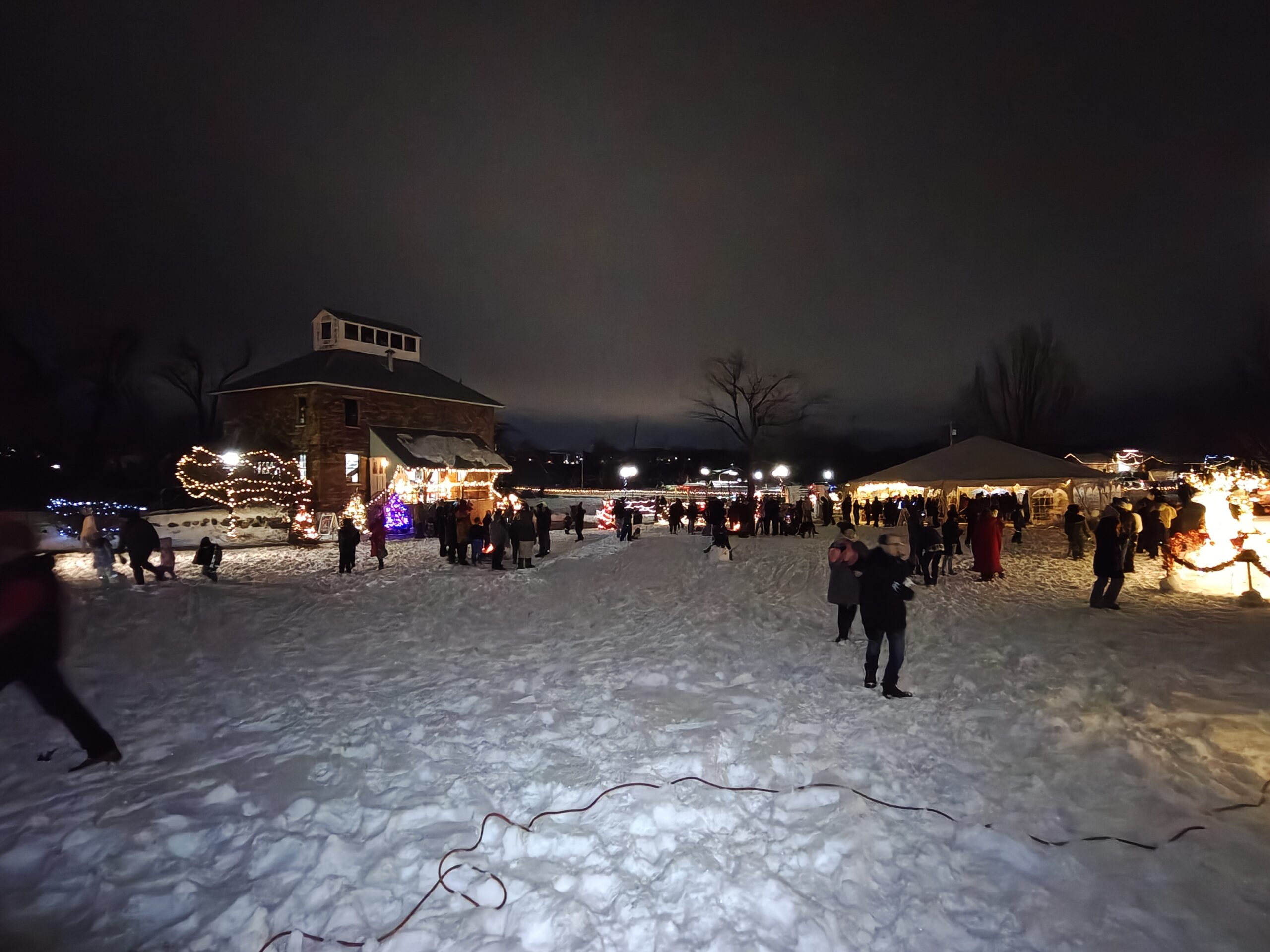 Nighttime photo of a snowy park, taken with the OnePlus 15R.