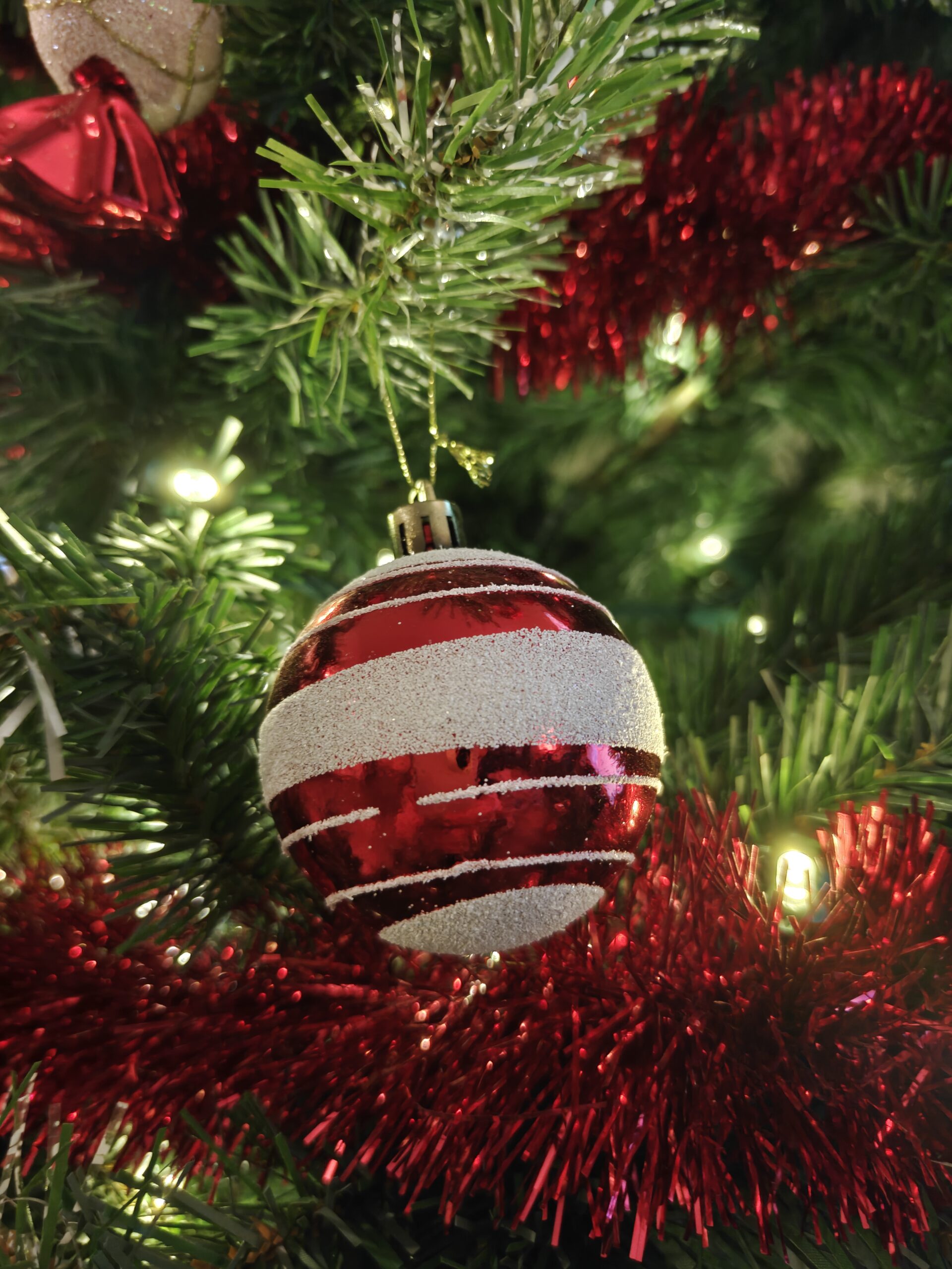 Photo of a red and white Christmas tree ornament, taken with the OnePlus 15R.
