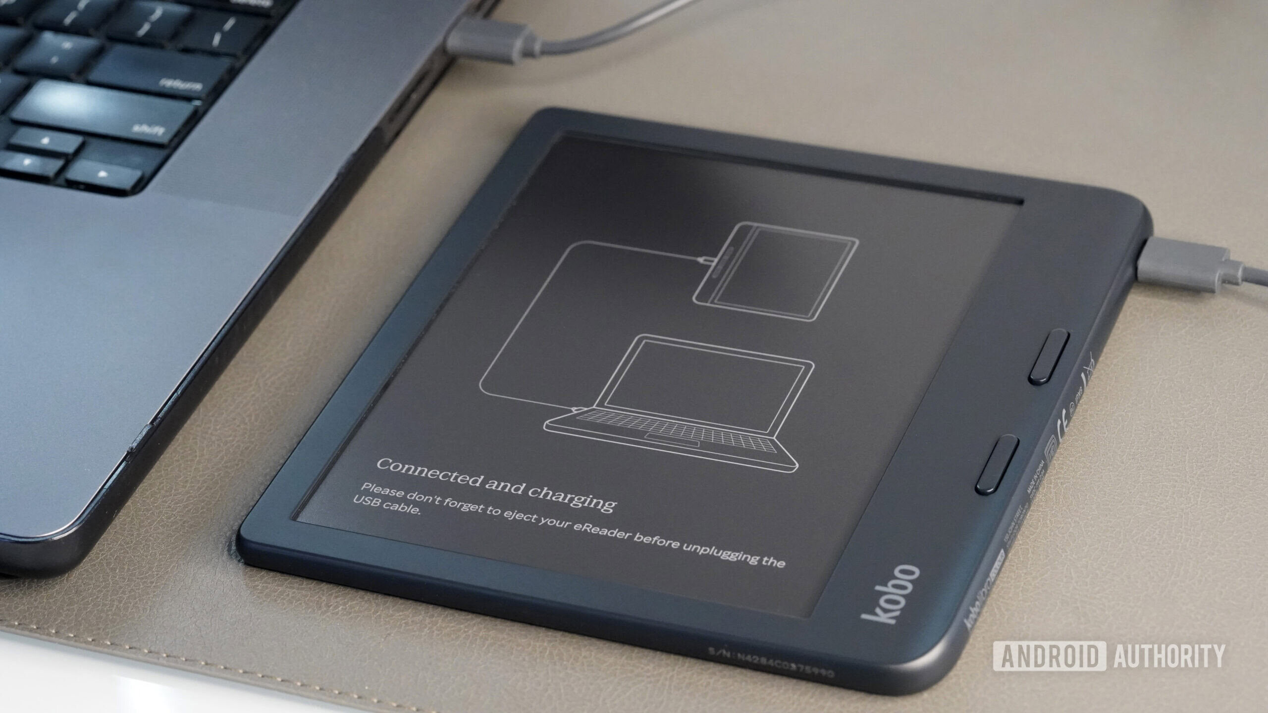 A Kobo Libra Colour user connects the device to a Mac via USB-C.
