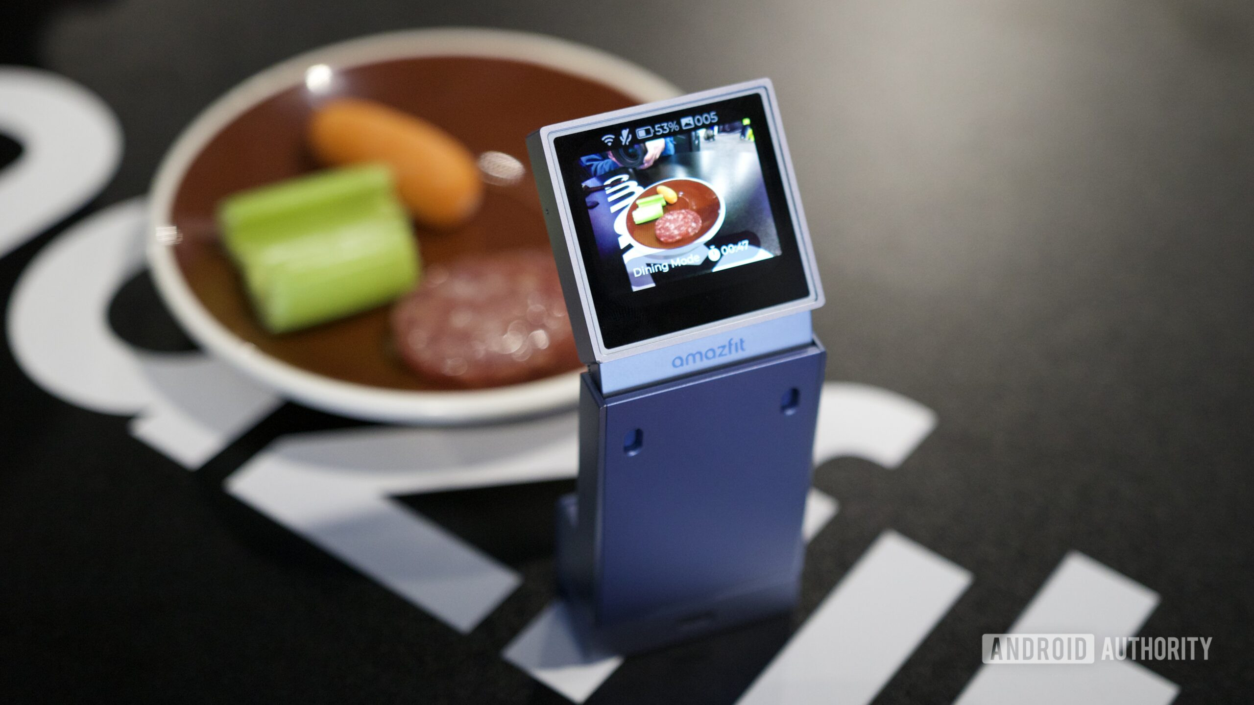 Amazfit V1TAL food camera at CES 2026 looking at a dish of snacks.