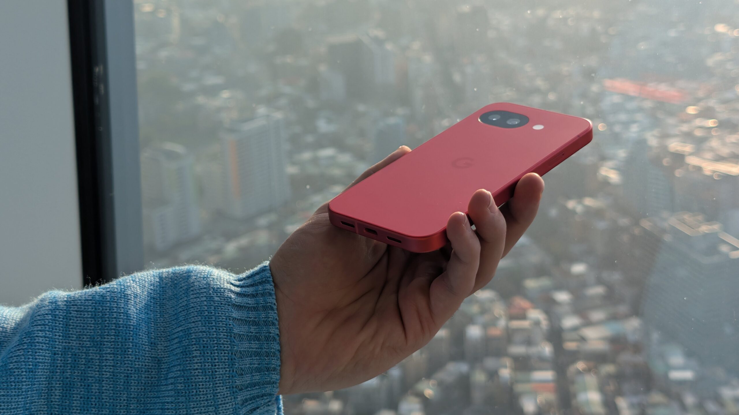 Google Pixel 10a red berry in hand