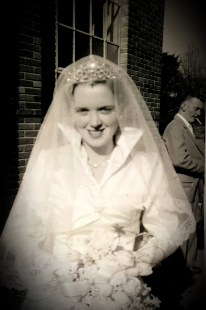 black and white image of a woman in a wedding dress