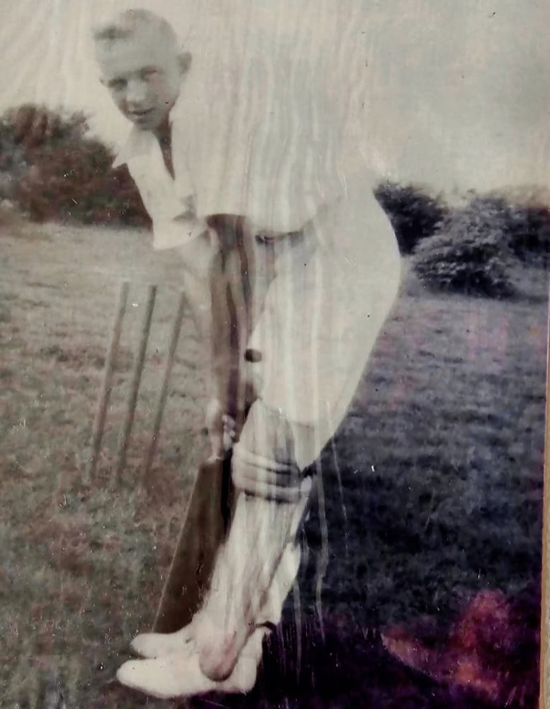 damaged image of a man playing cricket