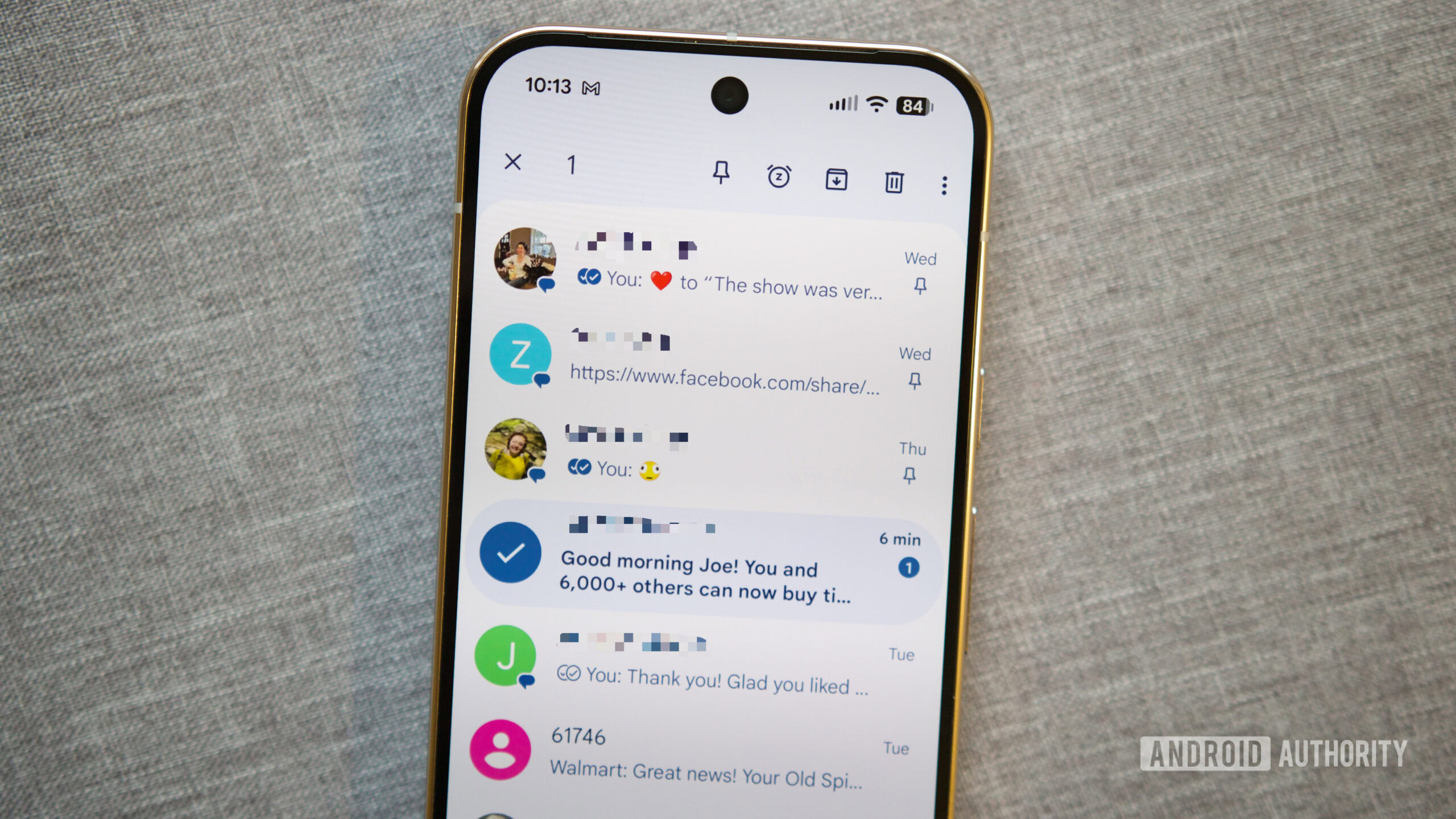 Pinning a conversation in Google Messages.