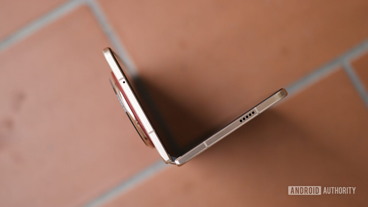 A top-down view of the HONOR Magic V6 partially open.