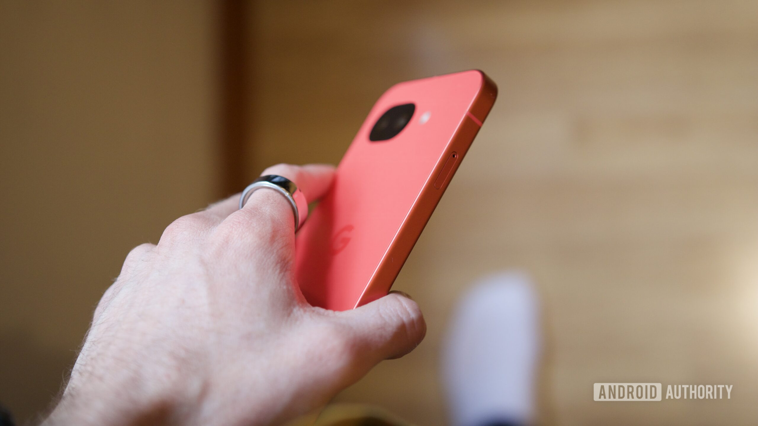google pixel 10a berry hands on joe 4 A side view of someone holding the Google Pixel 10a.