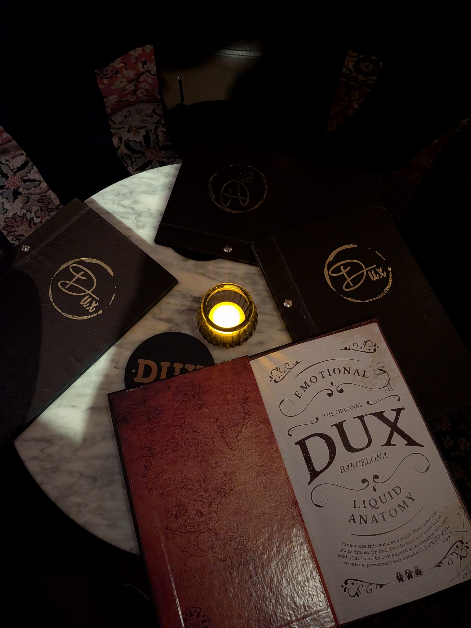 A photo of a menu in a dimly-lit bar, captured with the Google Pixel 10a.