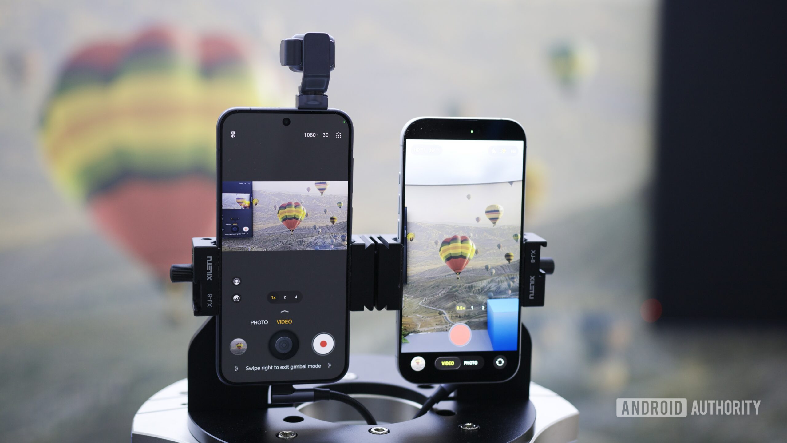 The HONOR Robot Phone next to an iPhone, showing the difference in video stabilization between the two.