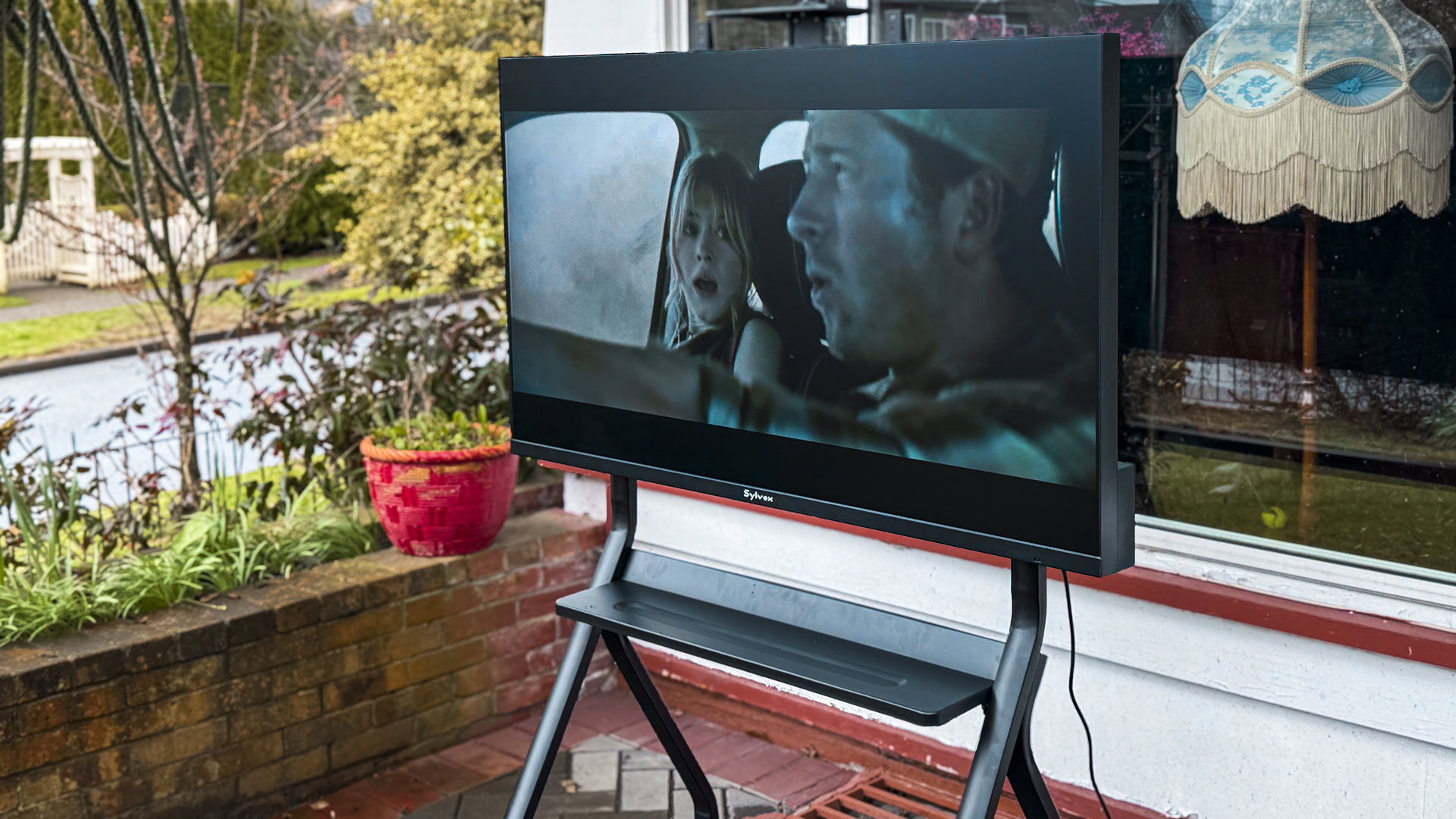 Slvox 55 Outdoor TV Frameless Pro watching Twisters
