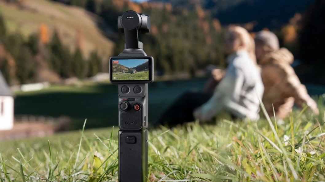 DJI Osmo Pocket 4 DJI Osmo Pocket 4 propped up on grass