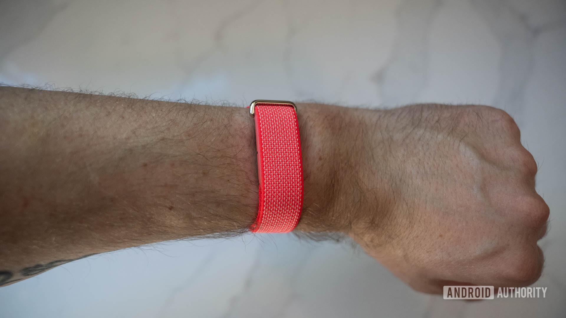 Fitbit Air Berry on wrist top