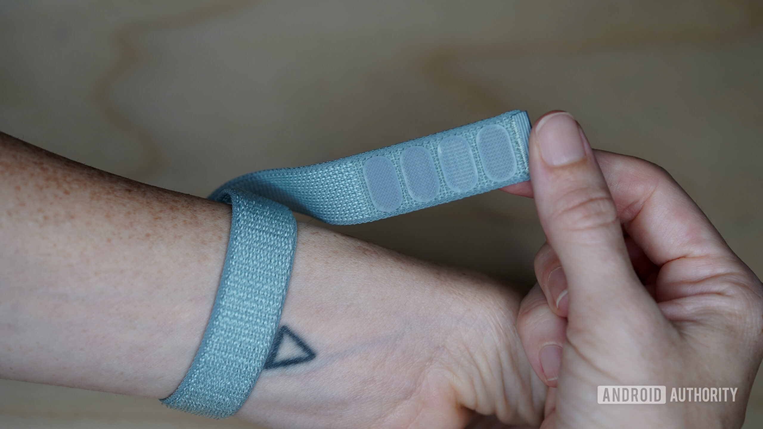 The Fitbit Air's nylon band features a Velcro closure.