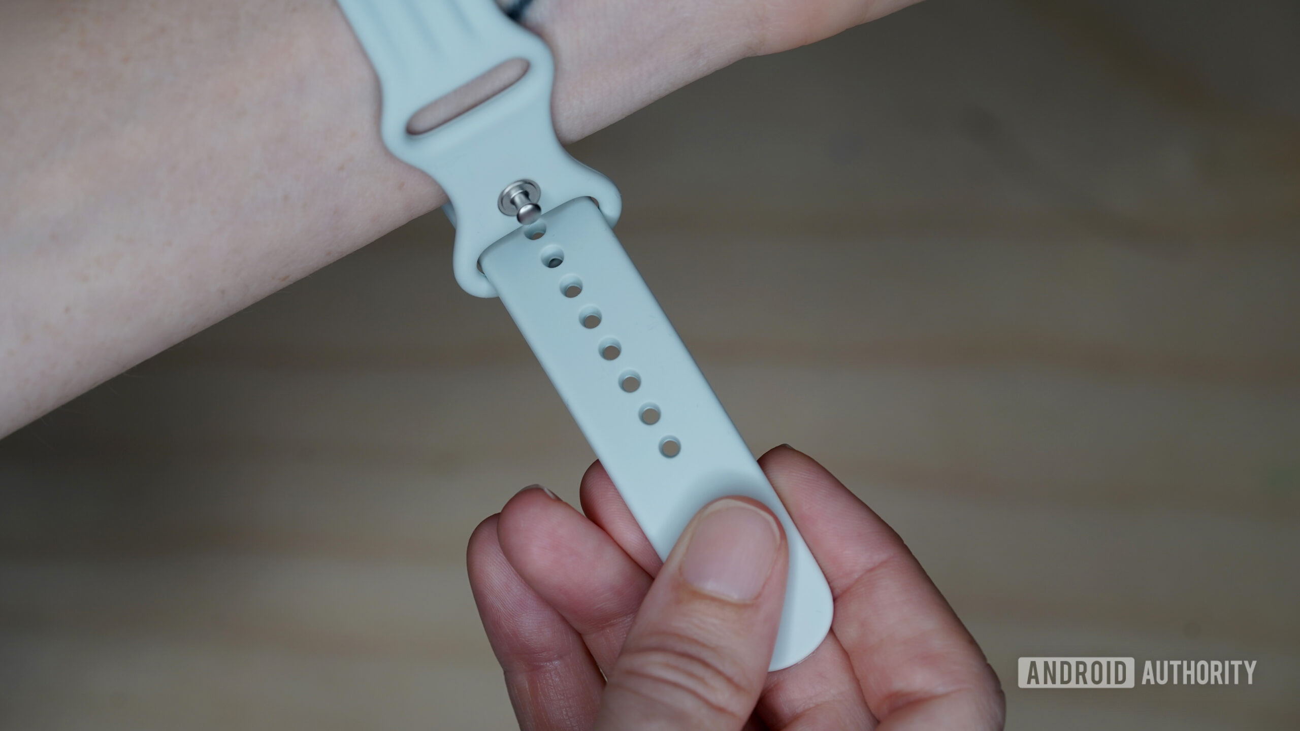 The Sport band features many pin holes for a nuanced fit.