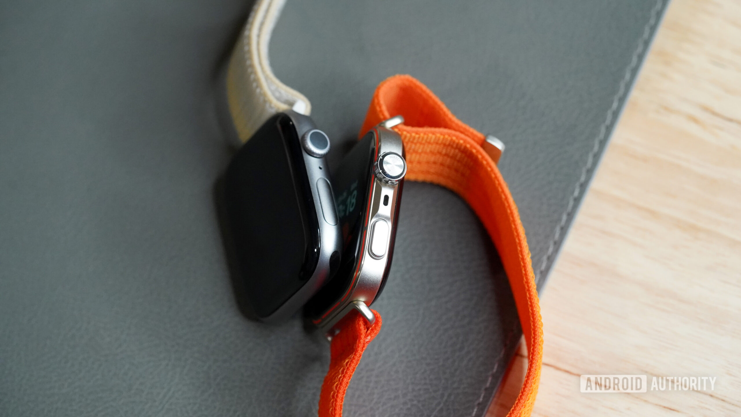 The HUAWEI Watch Fit 5 Pro rests along an Apple Watch Series 11.