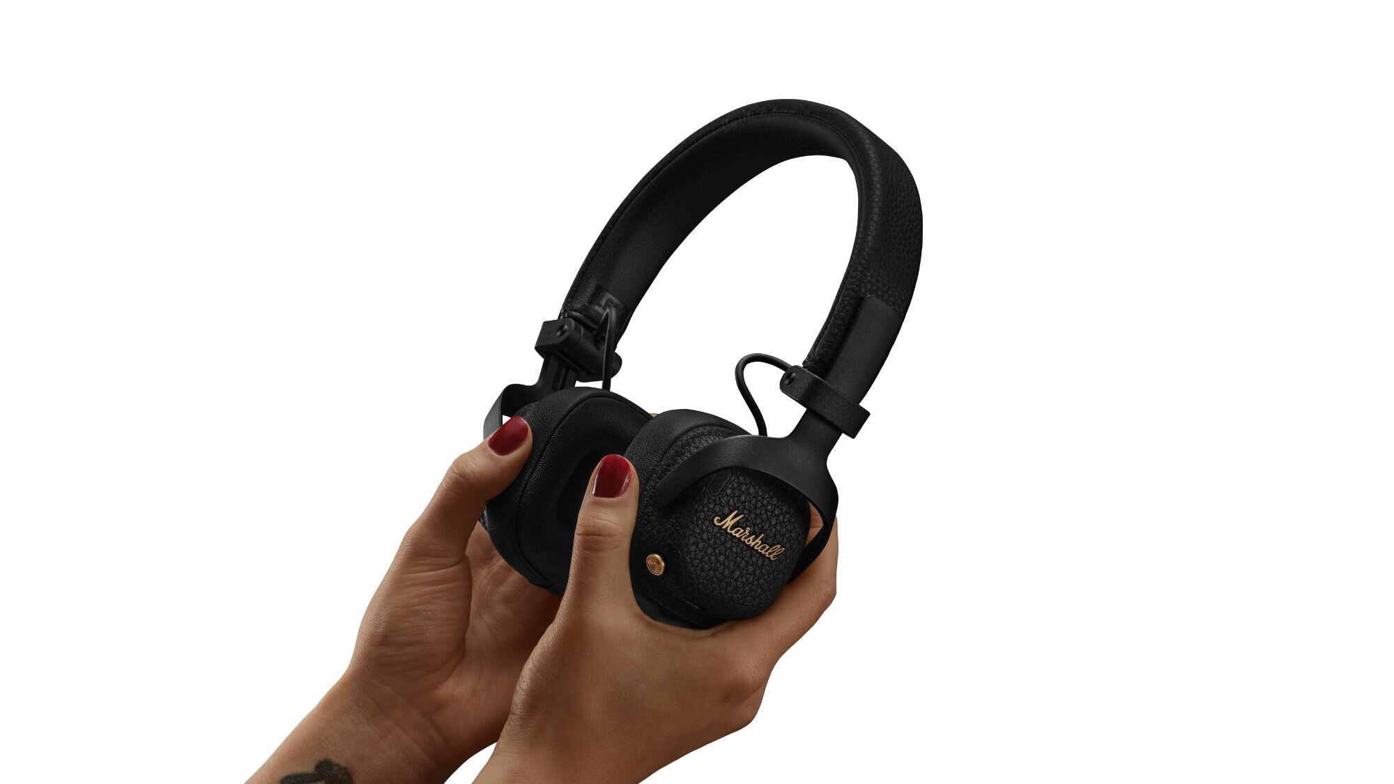 Marshall Milton ANC headphones in a person's hand