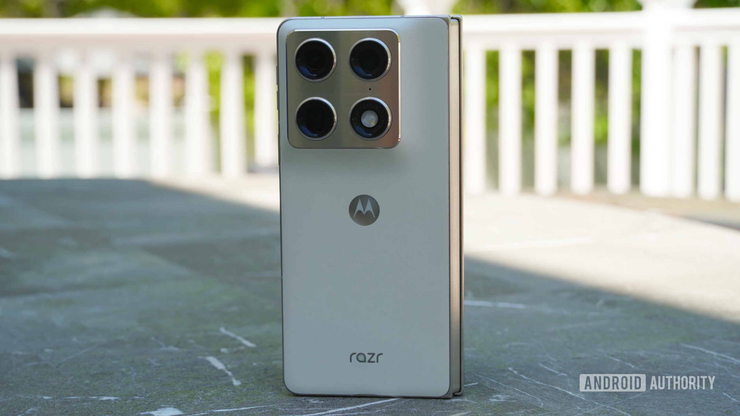 The Motorola Razr Fold in Lily White on a table.