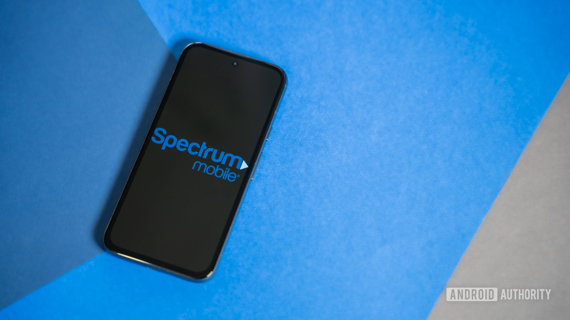 Spectrum Mobile logo on phone stock photo 3 Spectrum Mobile logo on phone stock photo 3