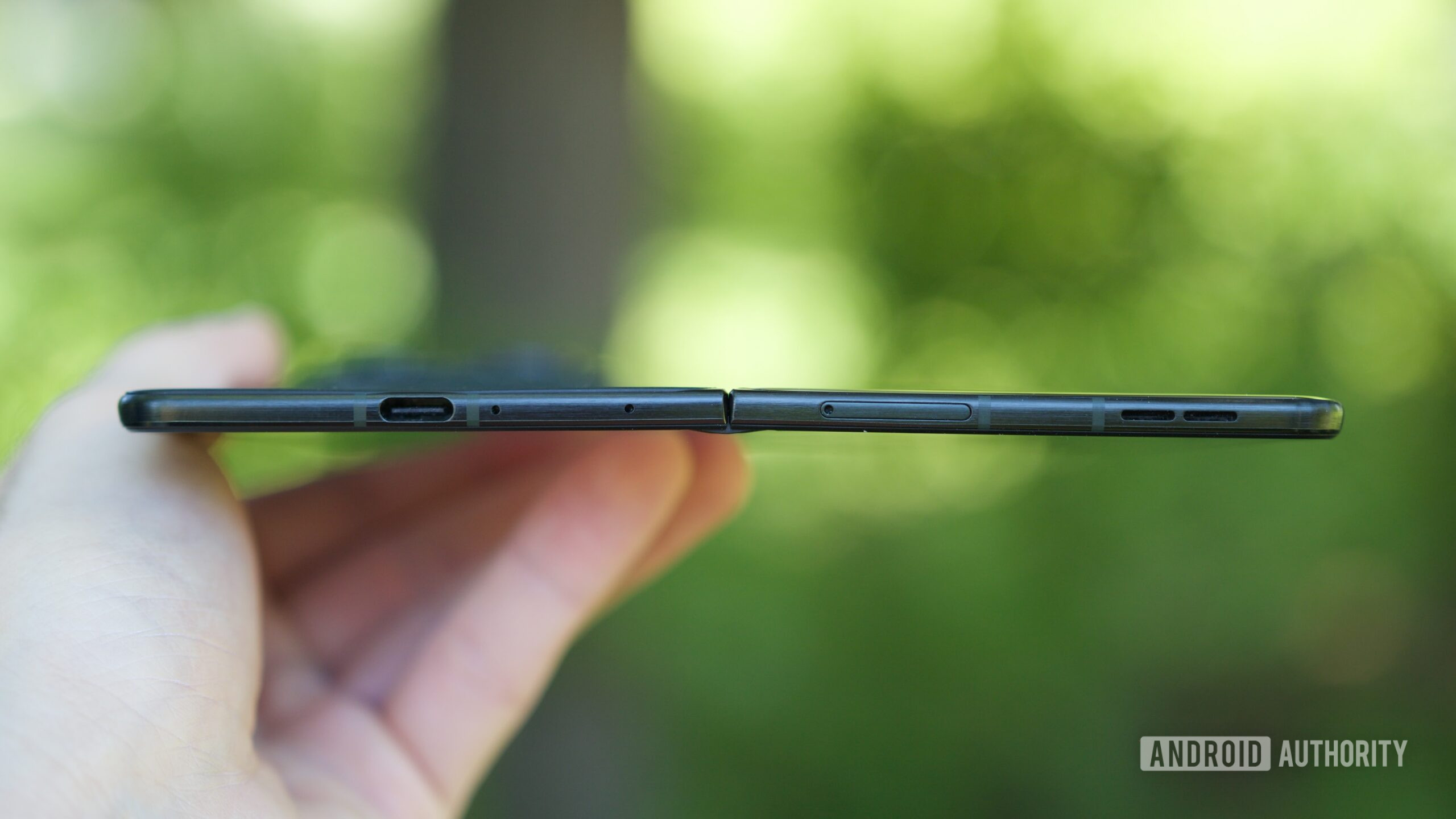 A side view of the Motorola Razr Fold unfolded, showing how thin it is.