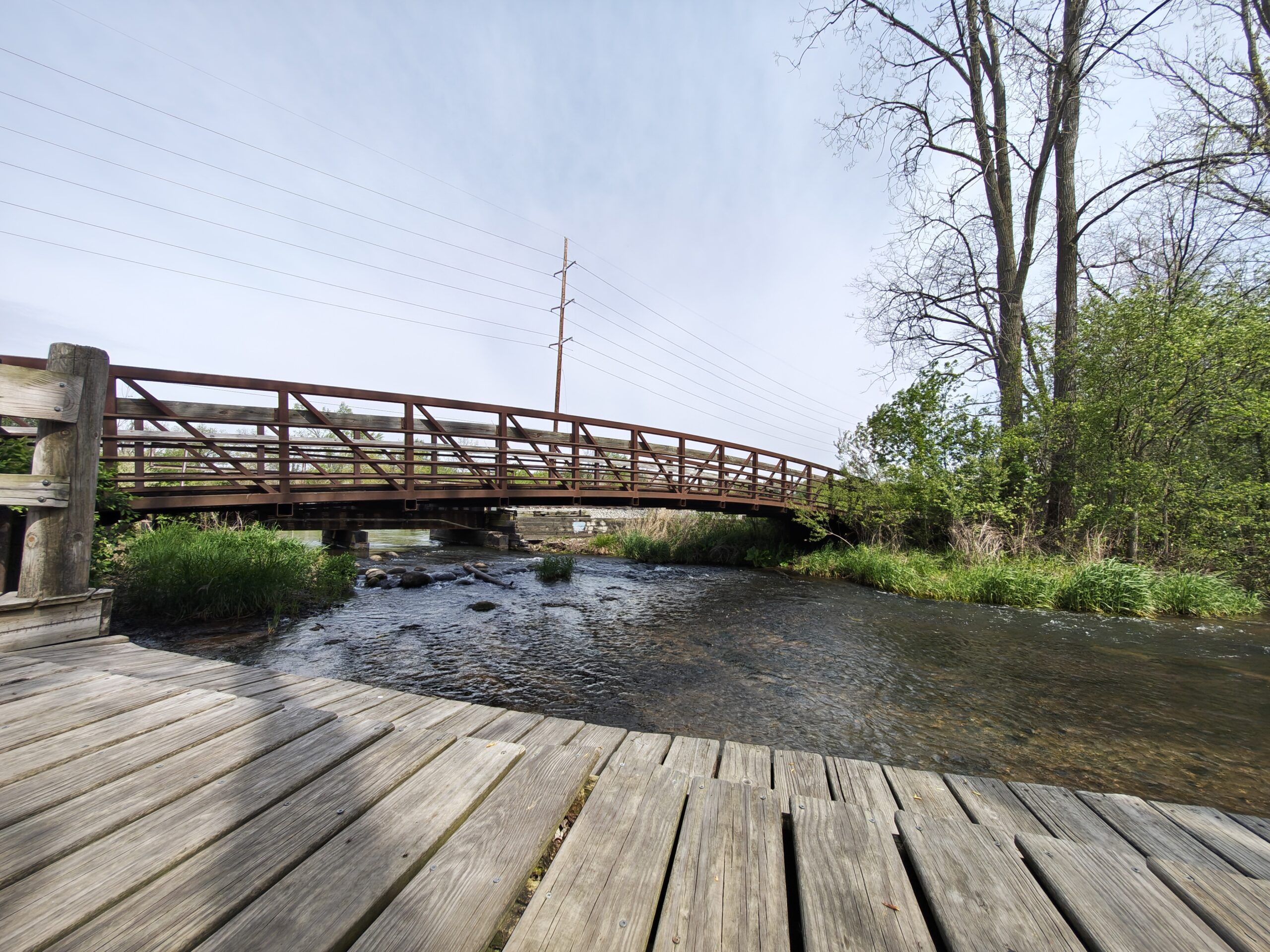 A photo of a bridge and a small creek, taken with the Motorola Razr Fold.