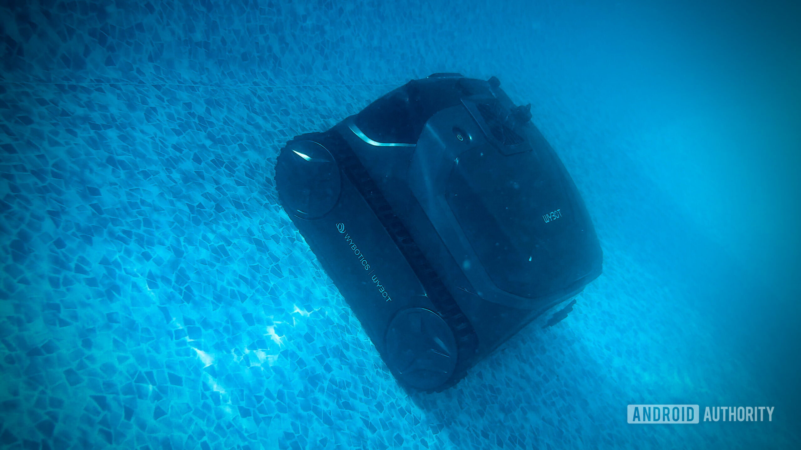 WYBOT S3 Robot Pool Cleaner 1 WYBOT S3 robot pool cleaner climbing a tiled pool wall underwater