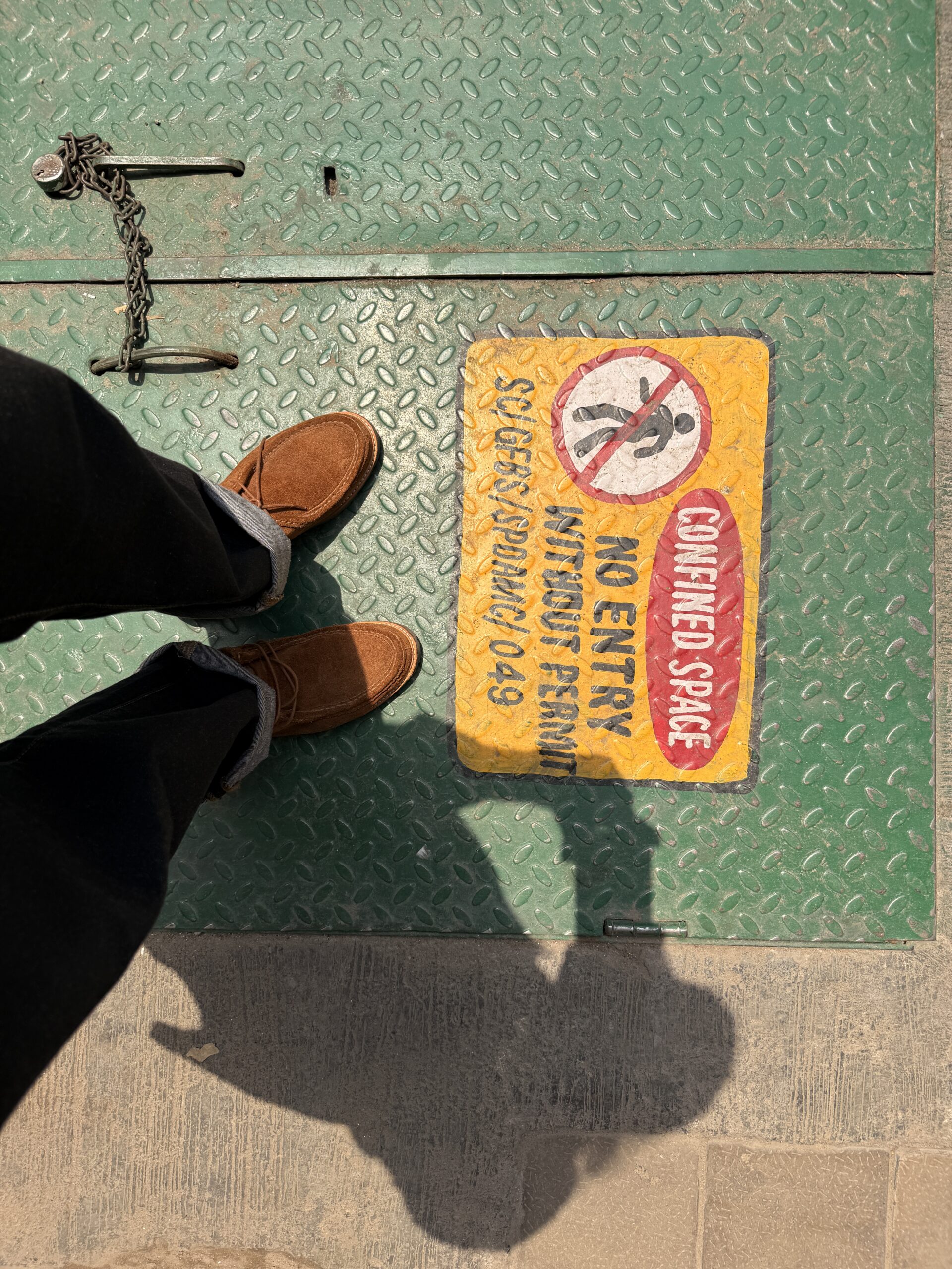 An image of a manhole entrance shot on the iPhone at 23mm
