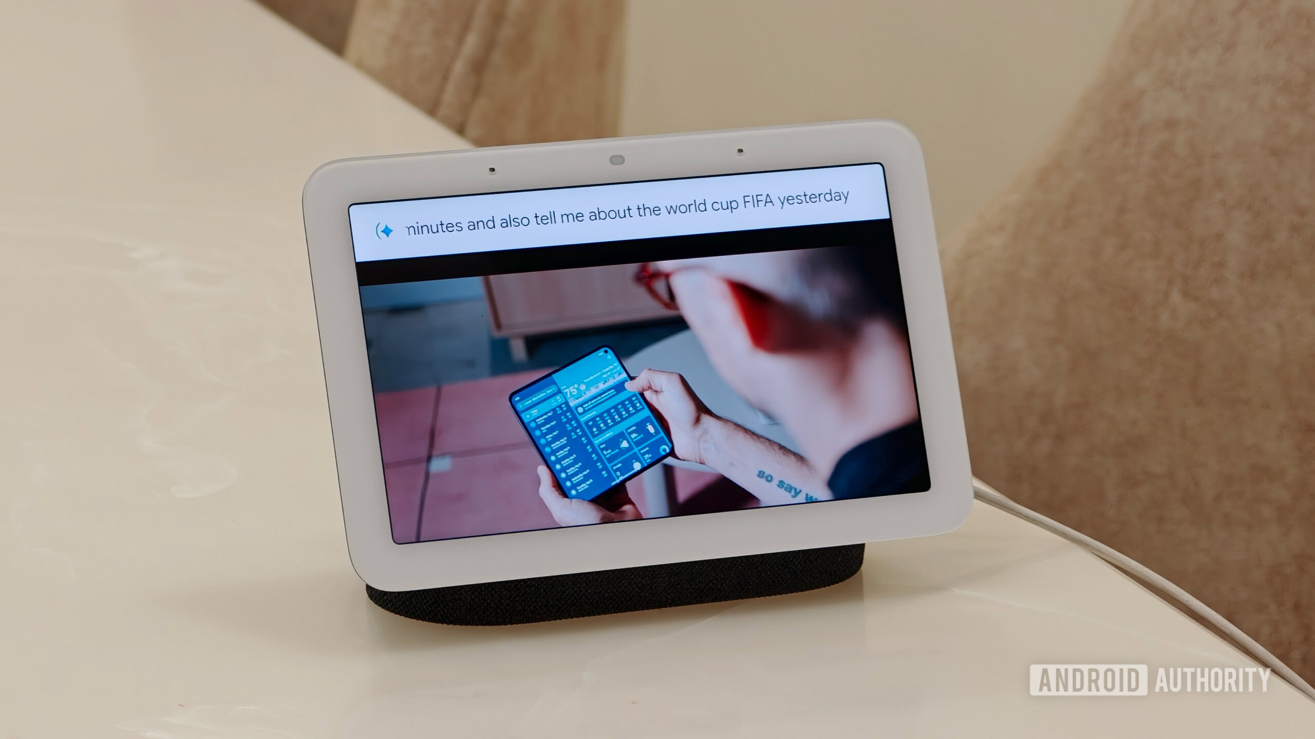google nest hub sanuj 1 Google Nest Hub playing a YouTube video with a voice command text overlay at the top