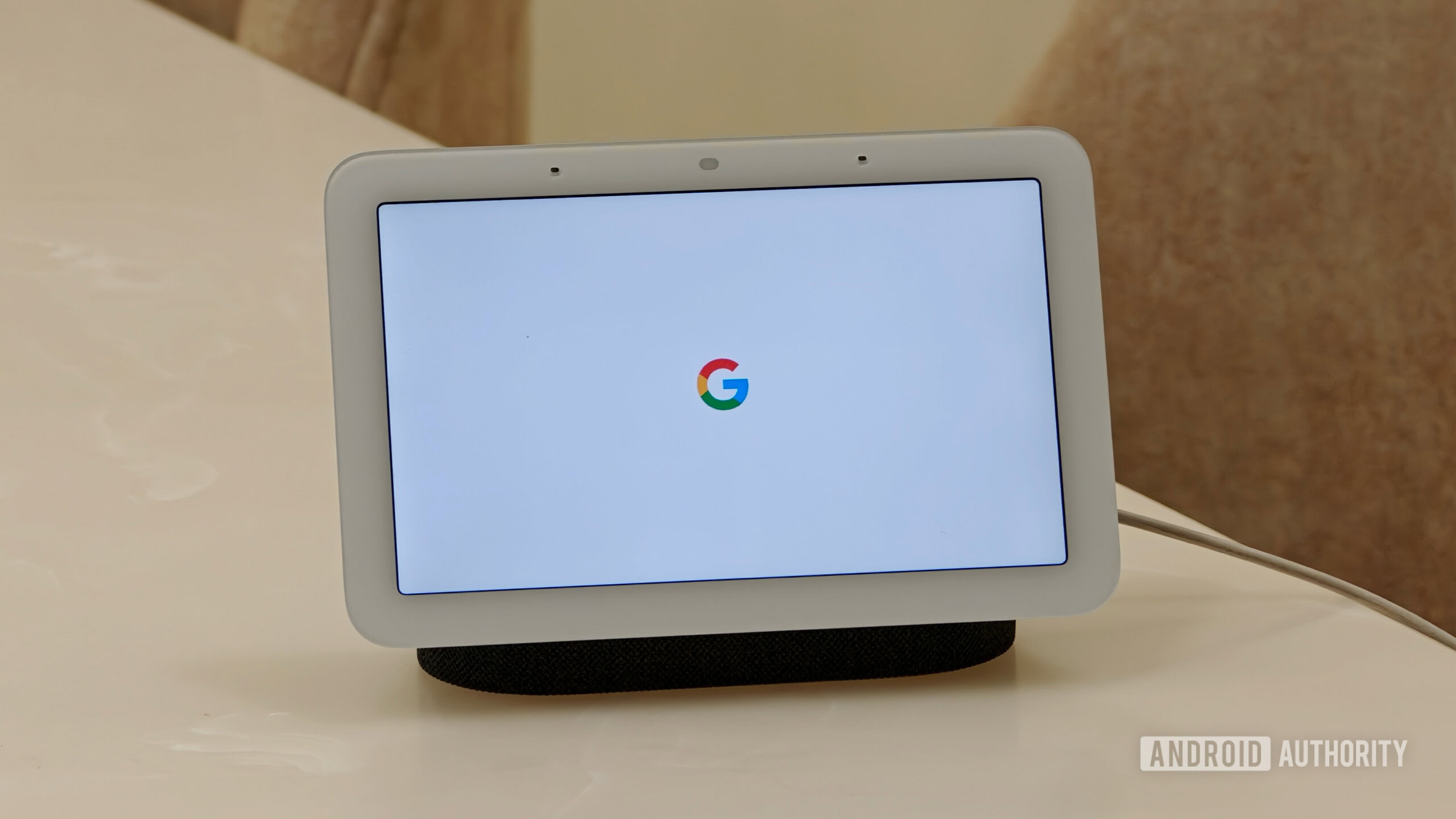google nest hub sanuj 5 Google Nest Hub display showing the classic colorful Google 'G' logo on white startup screen