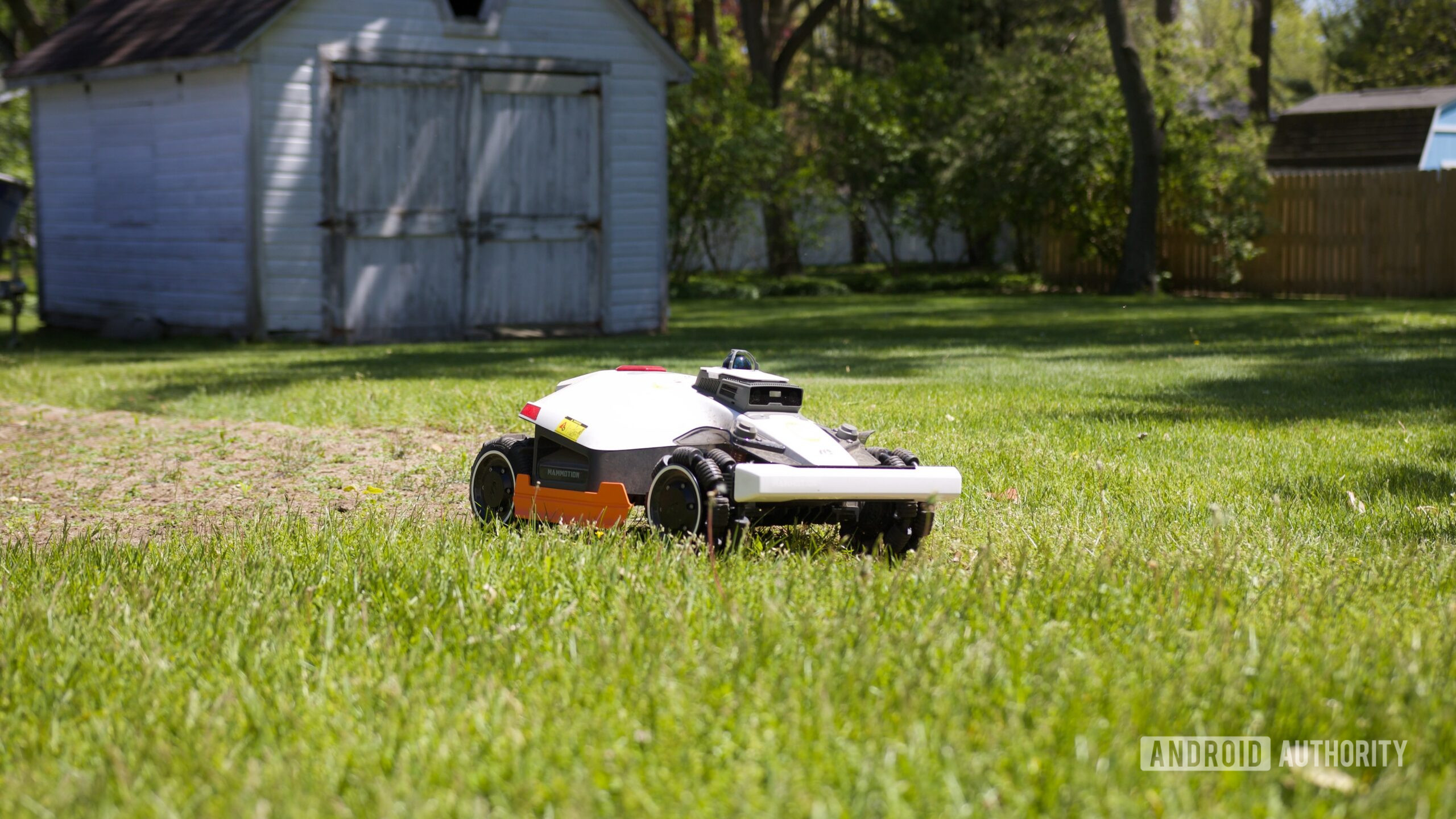 mammotion luba 3 awd review 4 The Mammotion LUBA 3 AWD mowing a yard.
