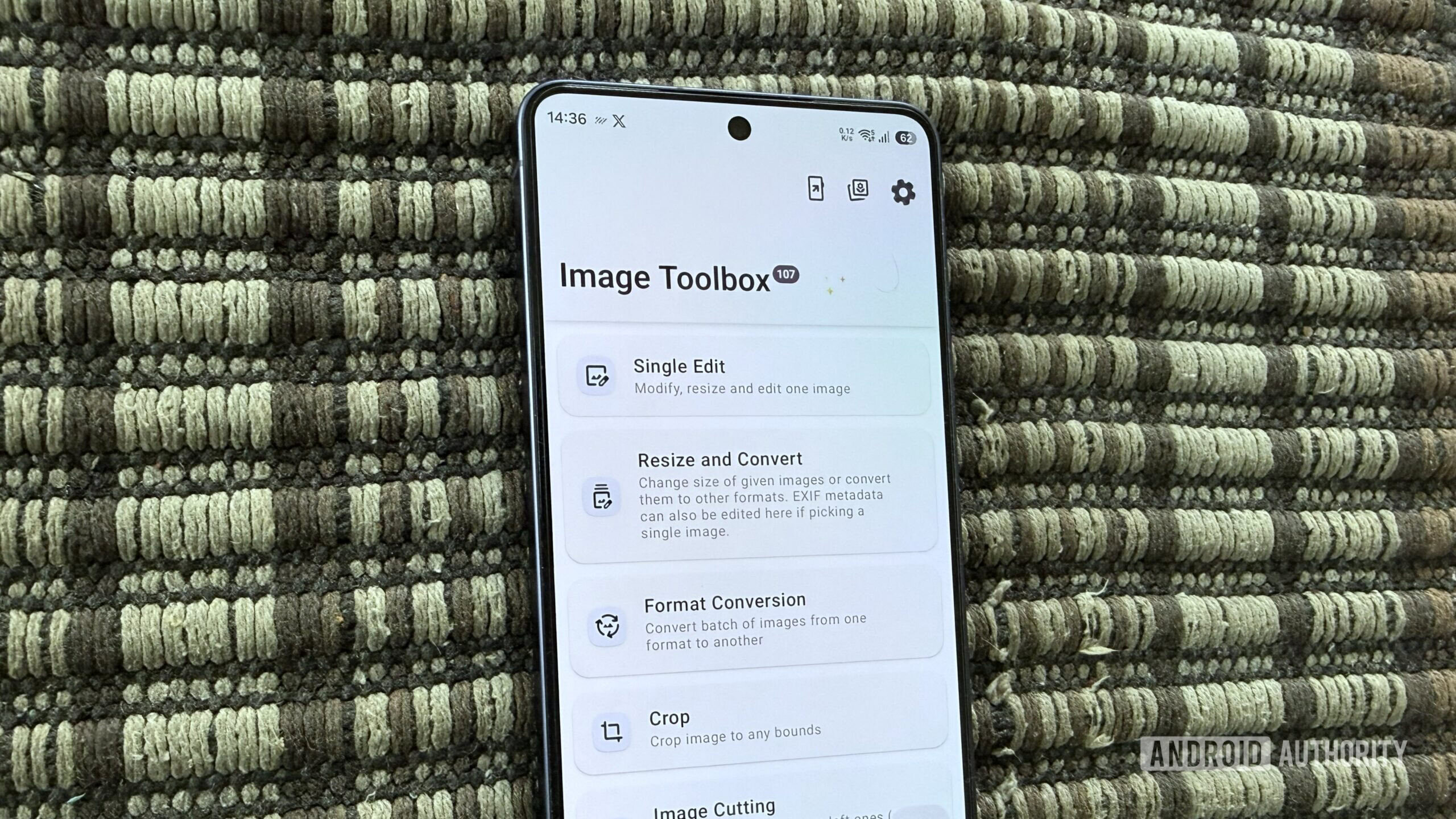 Android phone on a carpet showing Image Toolbox app Android phone on a carpet showing Image Toolbox app