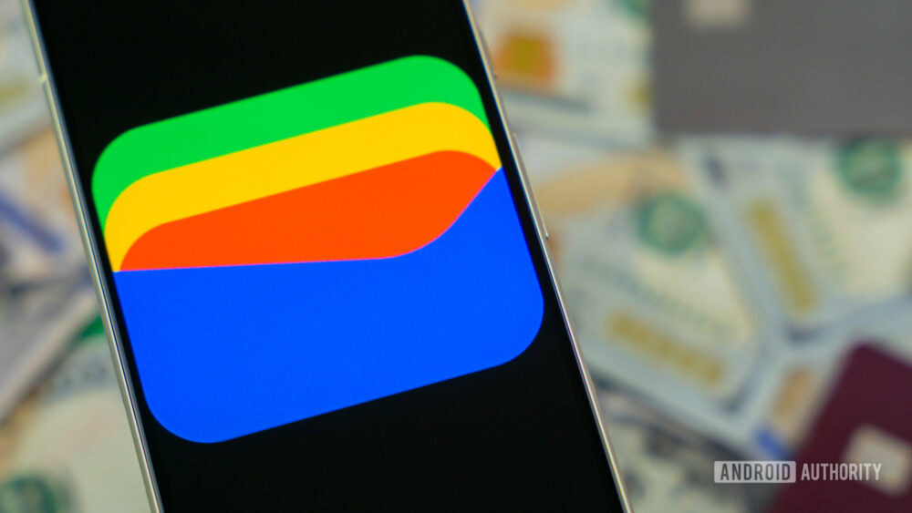Google Wallet logo on smartphone next to credit cards and cash Stock photo 12 1000w 563h