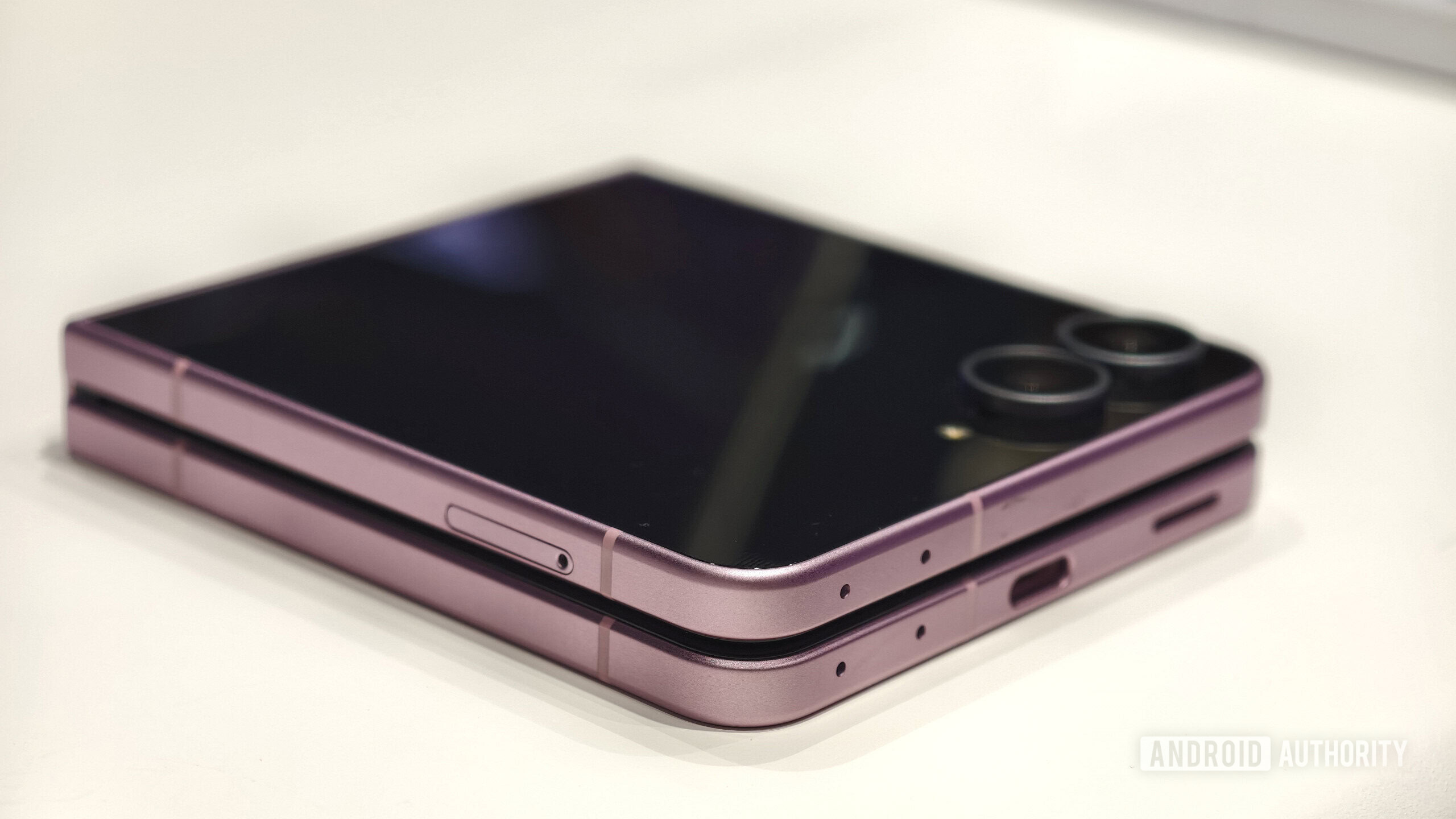 Samsung Galaxy Z Flip 8 closed on table Samsung Galaxy Z Flip 8 closed on table
