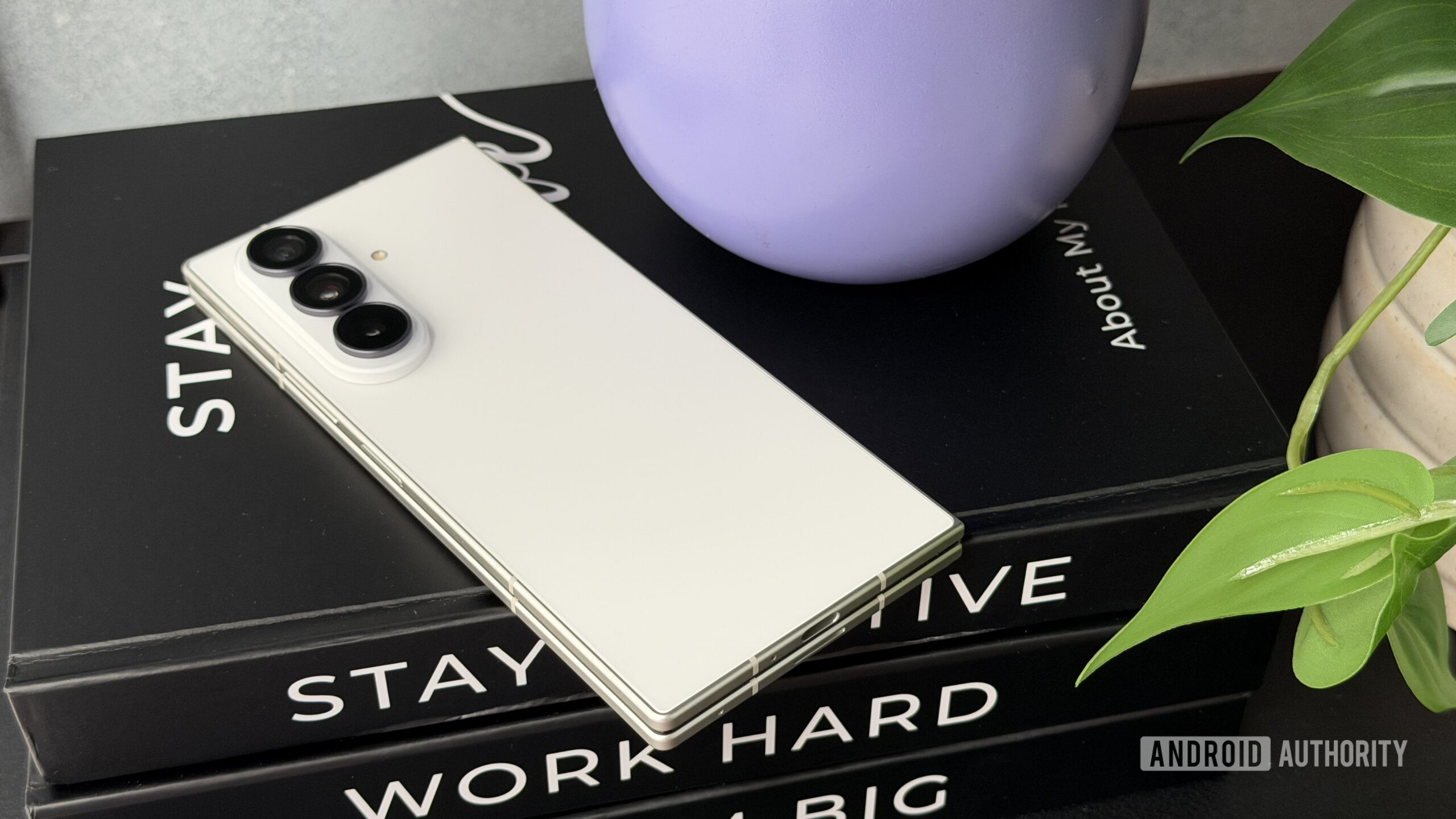 Samsung Galaxy Z Fold 8 Ultra laying on books Samsung Galaxy Z Fold 8 Ultra laying on books