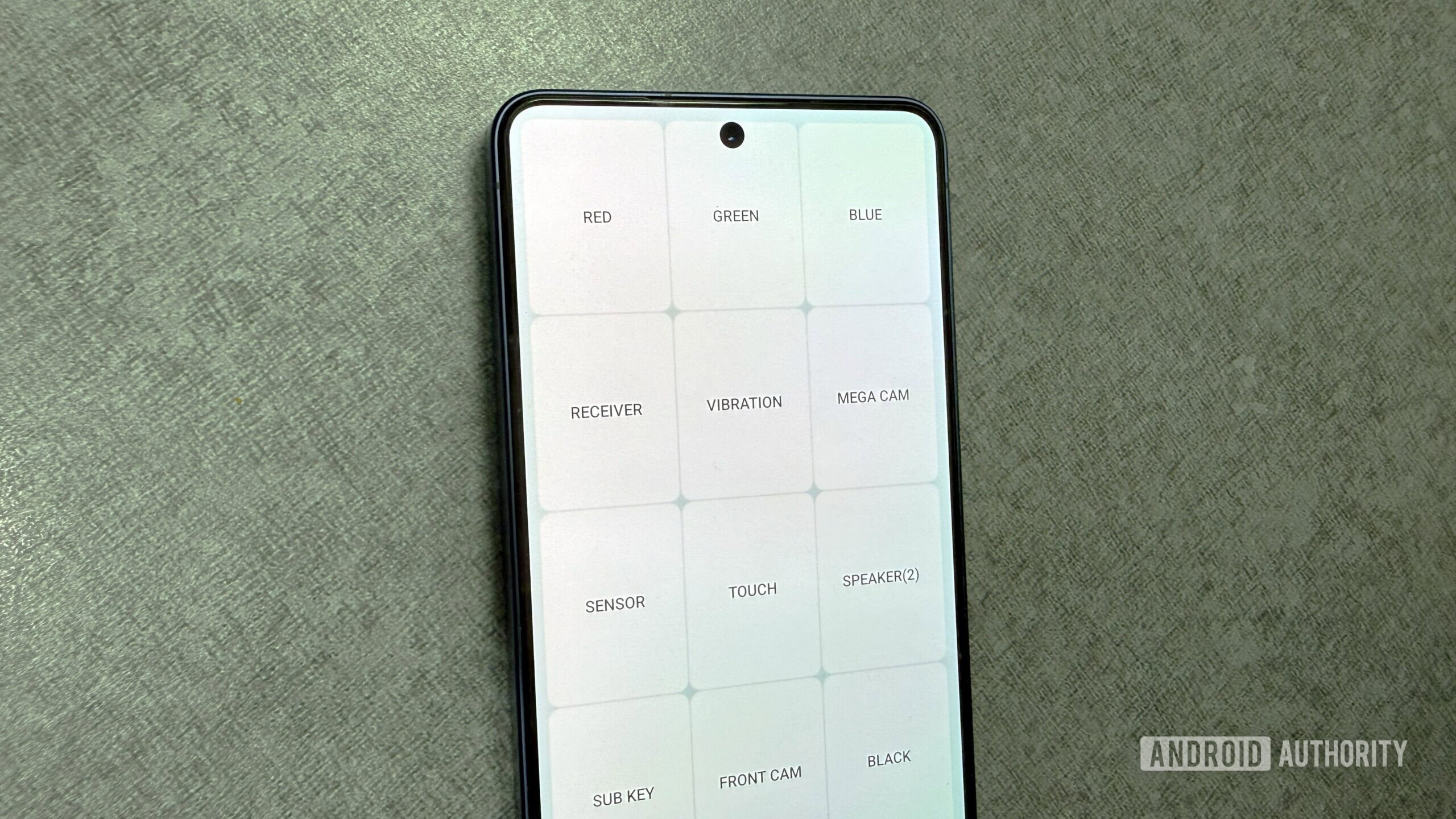Samsung phone on the table with the diagnostics menu open Samsung phone on the table with the diagnostics menu open