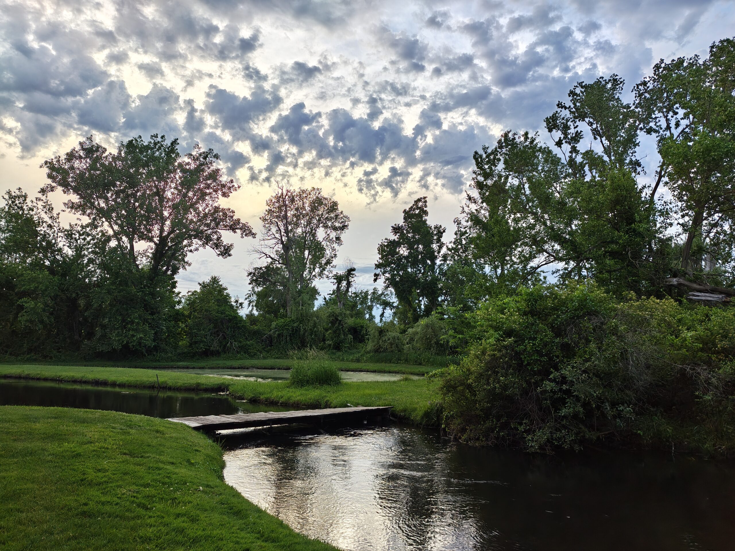 A photo of a small body of water and a bridge, taken with the Motorola Razr Fold.