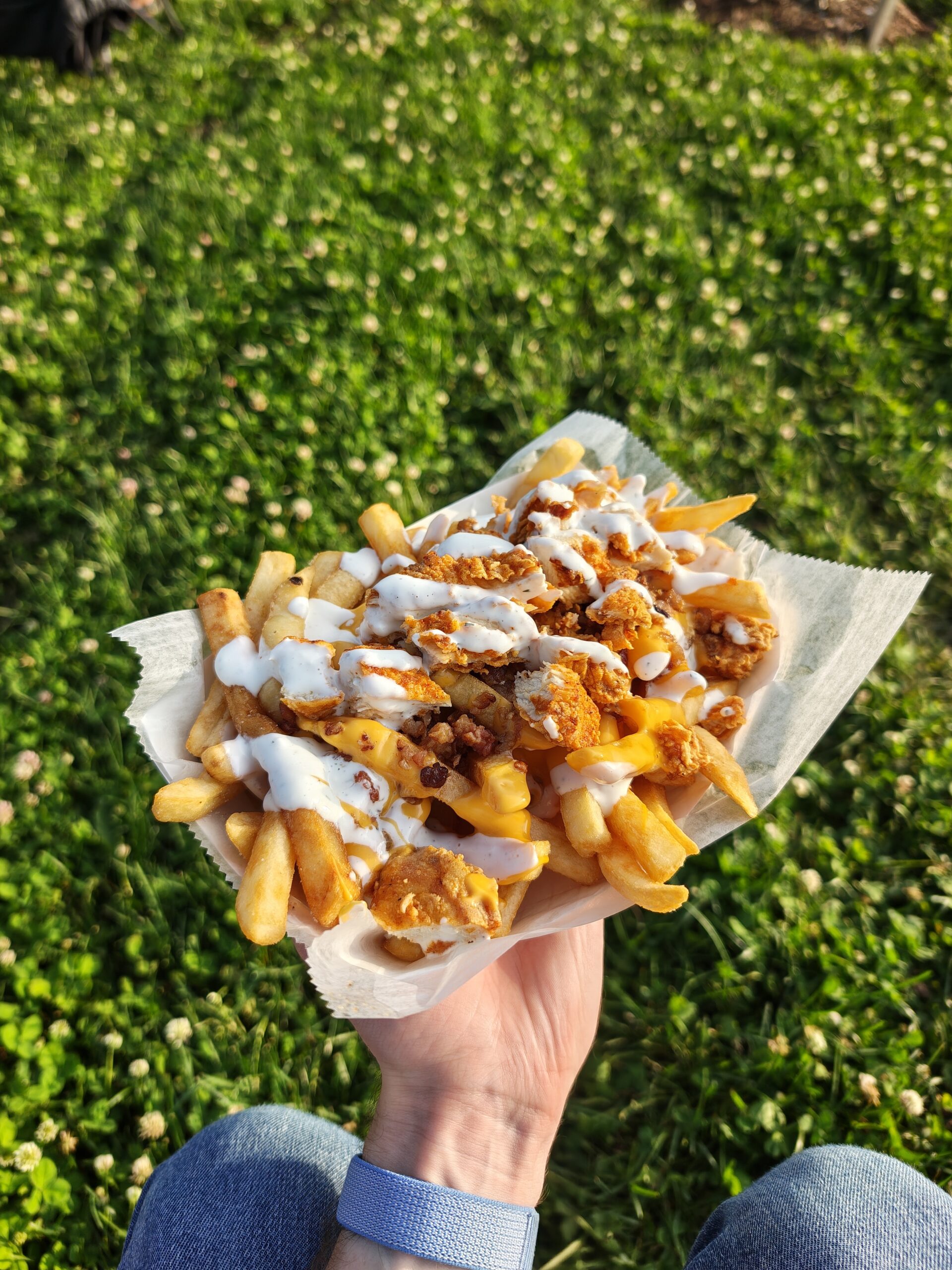A photo of loaded fries with chicken tenders, taken with the Motorola Razr Fold.