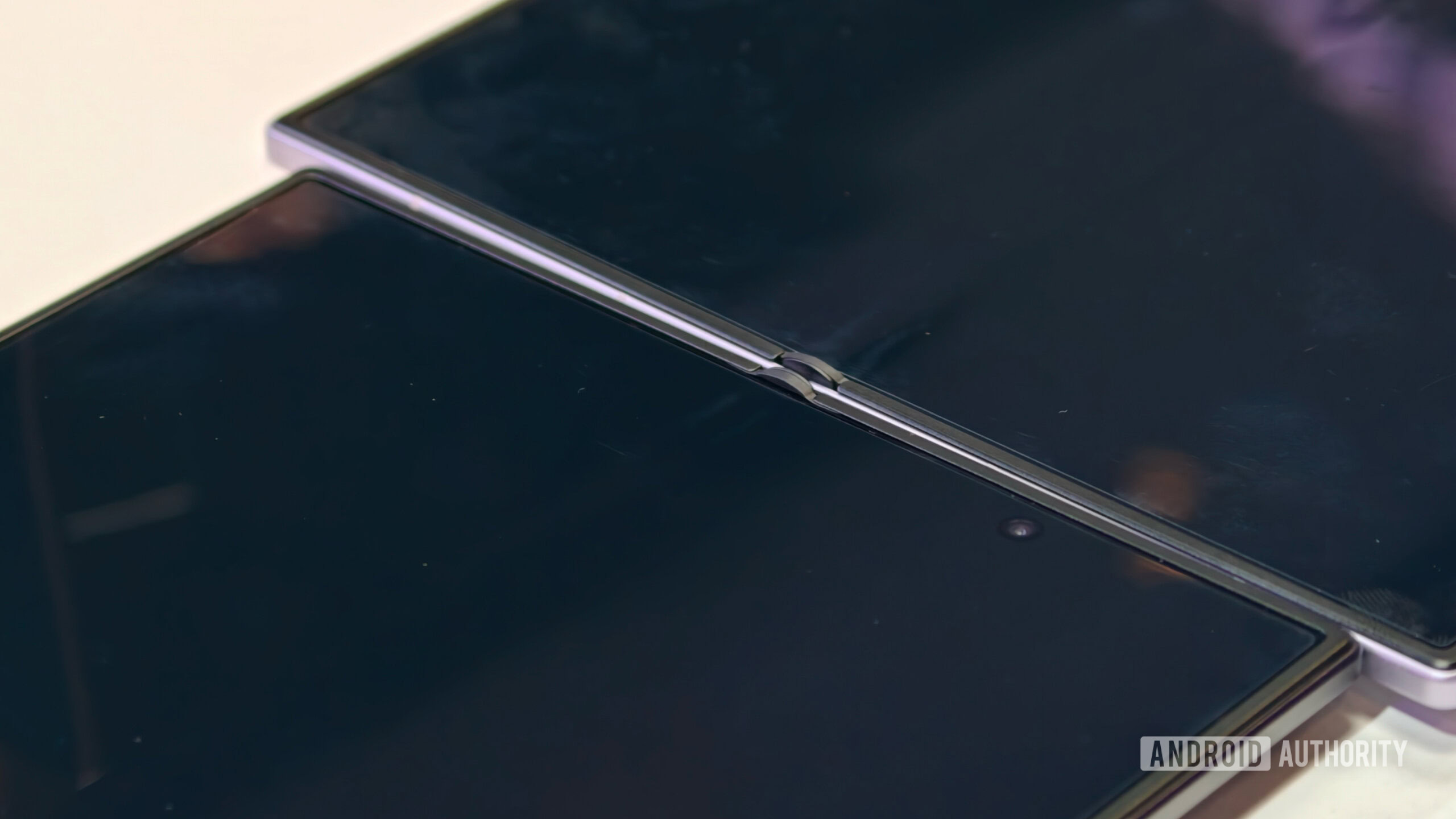 z fold 8 launch day 5 Extreme close-up macro shot of two foldable smartphone inner screens placed side-by-side to highlight the folding display crease