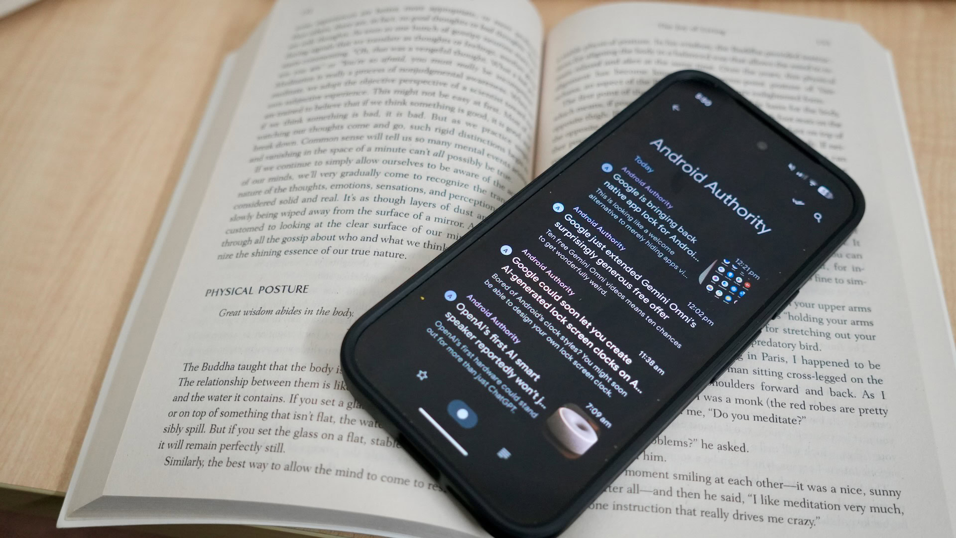 Read You RSS reader shown on top of a paperback book.