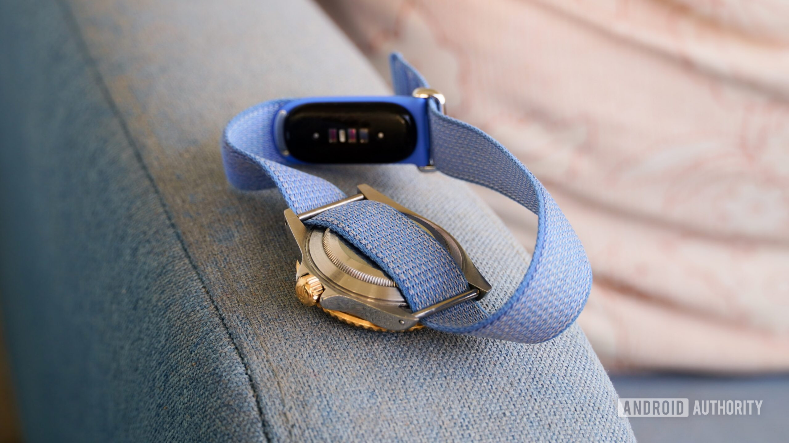The Fitbit Air sensors on a strap with an analog watch.