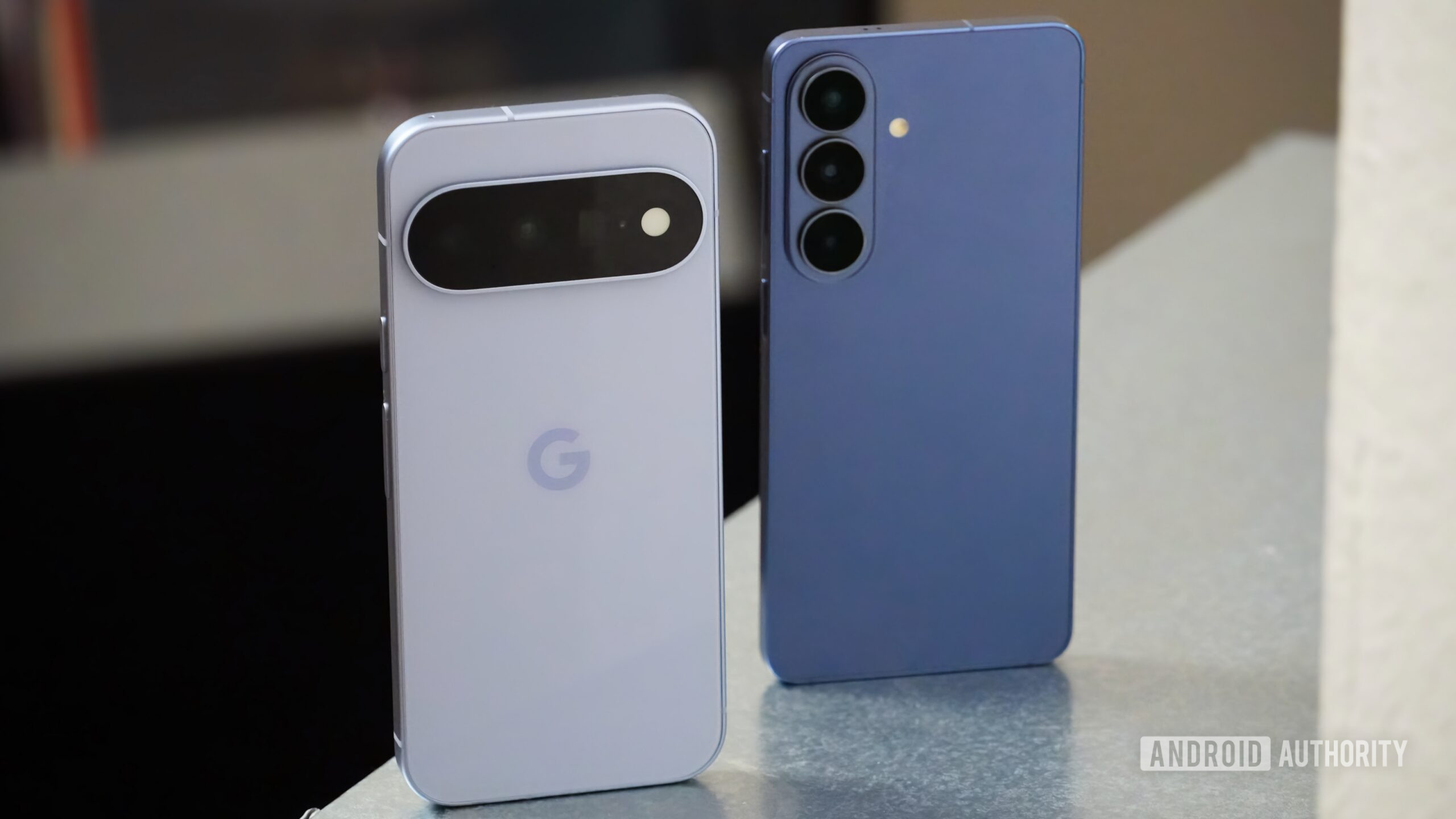 Pixel 11 vs Galaxy S26 2 The Google Pixel 11 and Samsung Galaxy S26 standing up.