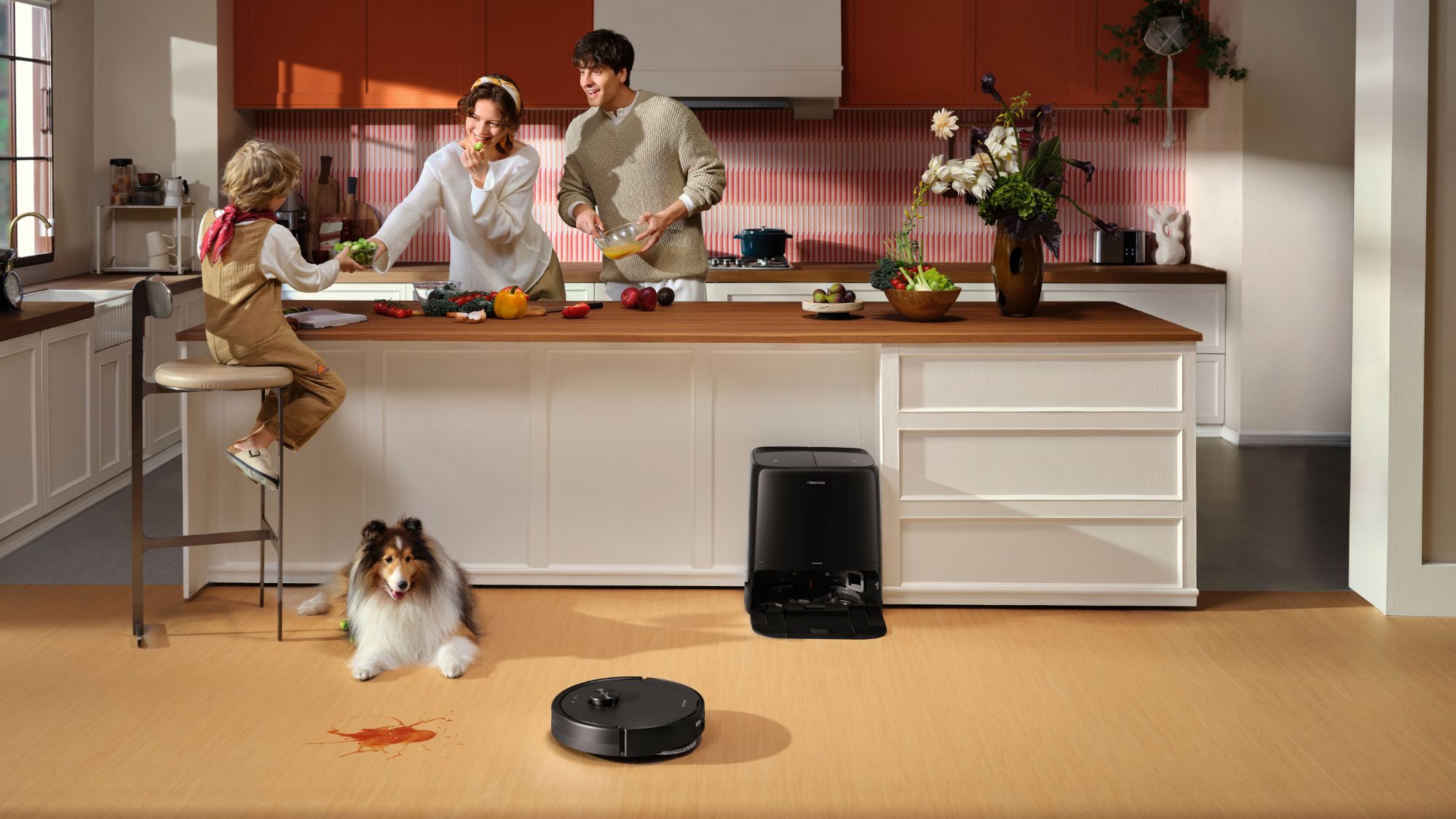 Roborock Qrevo 2 Pro besides a dog, kid and parents in the kitchen Roborock Qrevo 2 Pro besides a dog, kid and parents in the kitchen