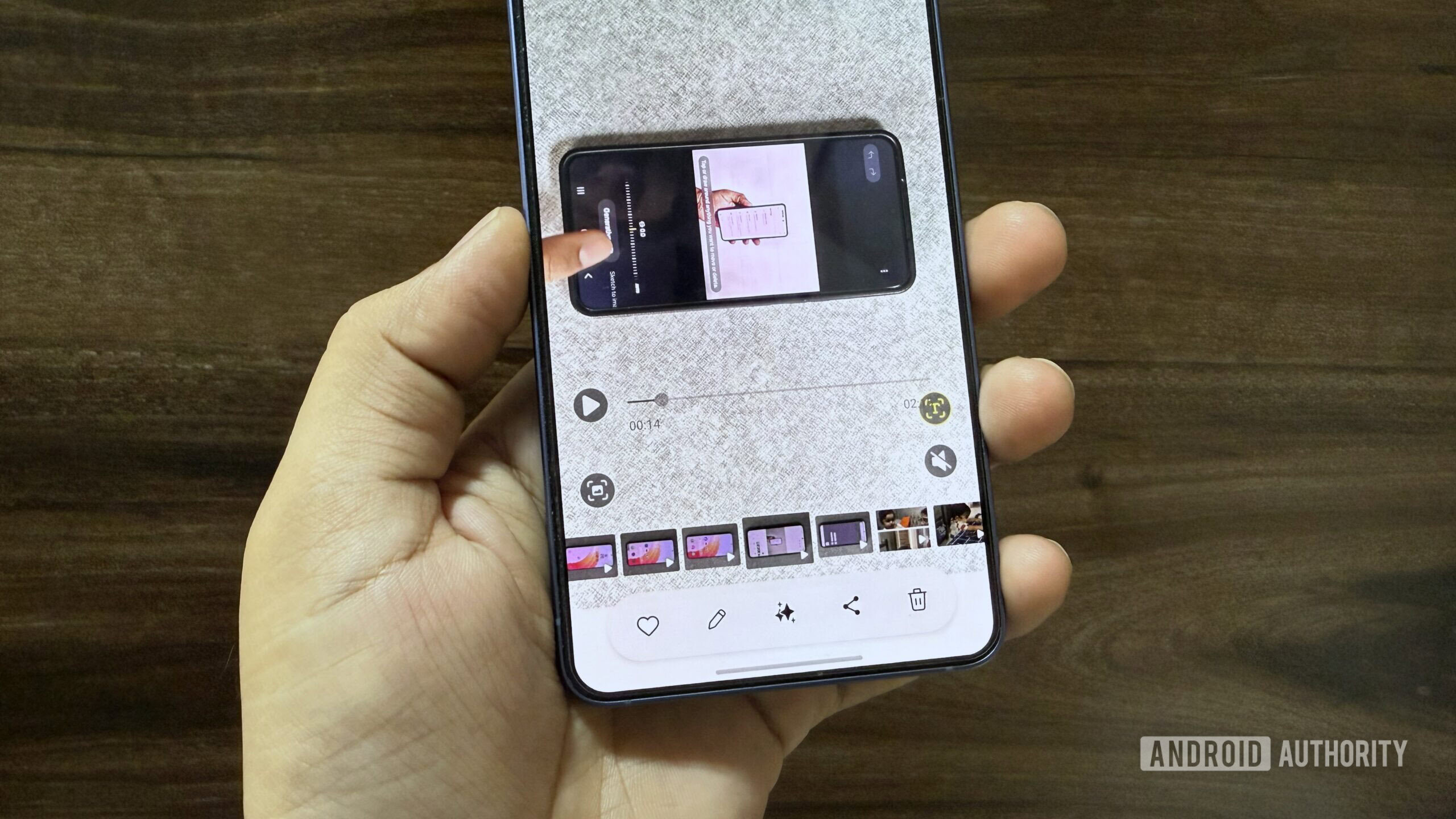 Samsung phone in hand playing a video in Gallery app